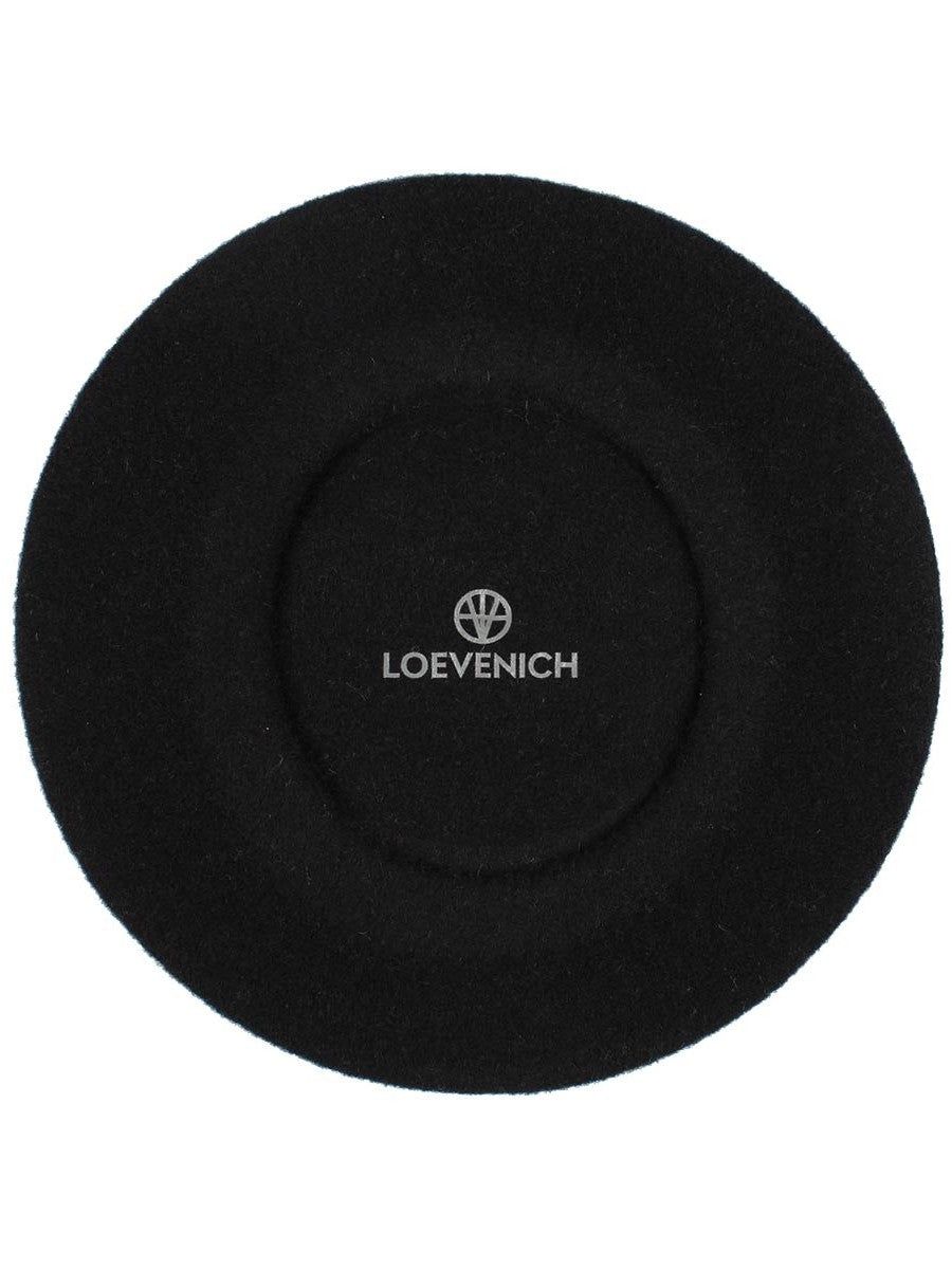 Black beret with circular crown and LOEVENICH logo centered on top