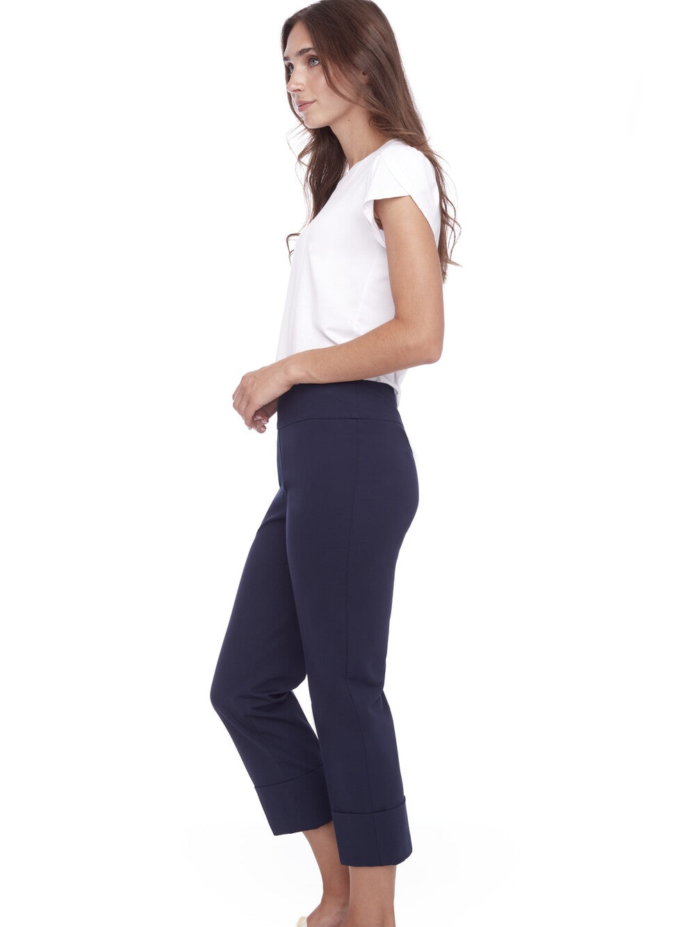 Navy UP Cool Compression 25" Deep Cuff Pant by Up displayed with a white short sleeve top, side view.
