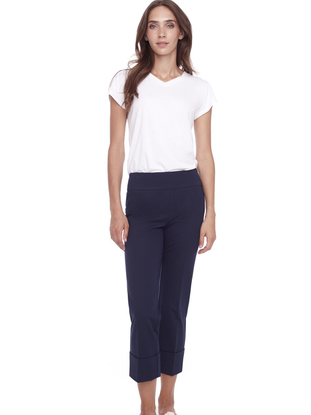 Navy UP Cool Compression 25" Deep Cuff Pant by Up paired with a white short sleeve top on model