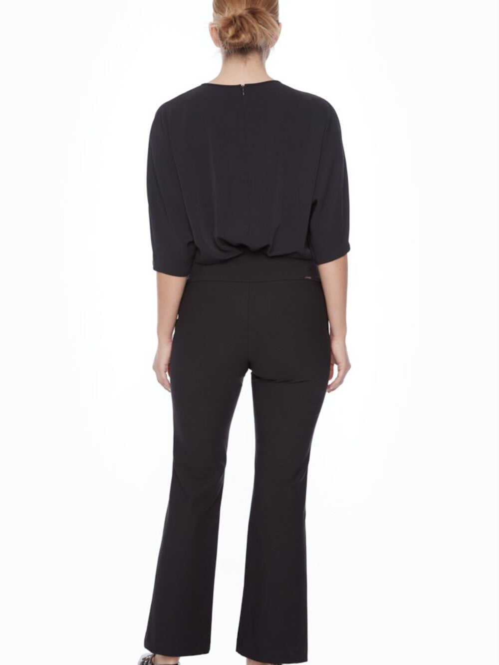 Rear view of Up UP Precision Ponte Slim Boot 31" Pant in black on model against white background