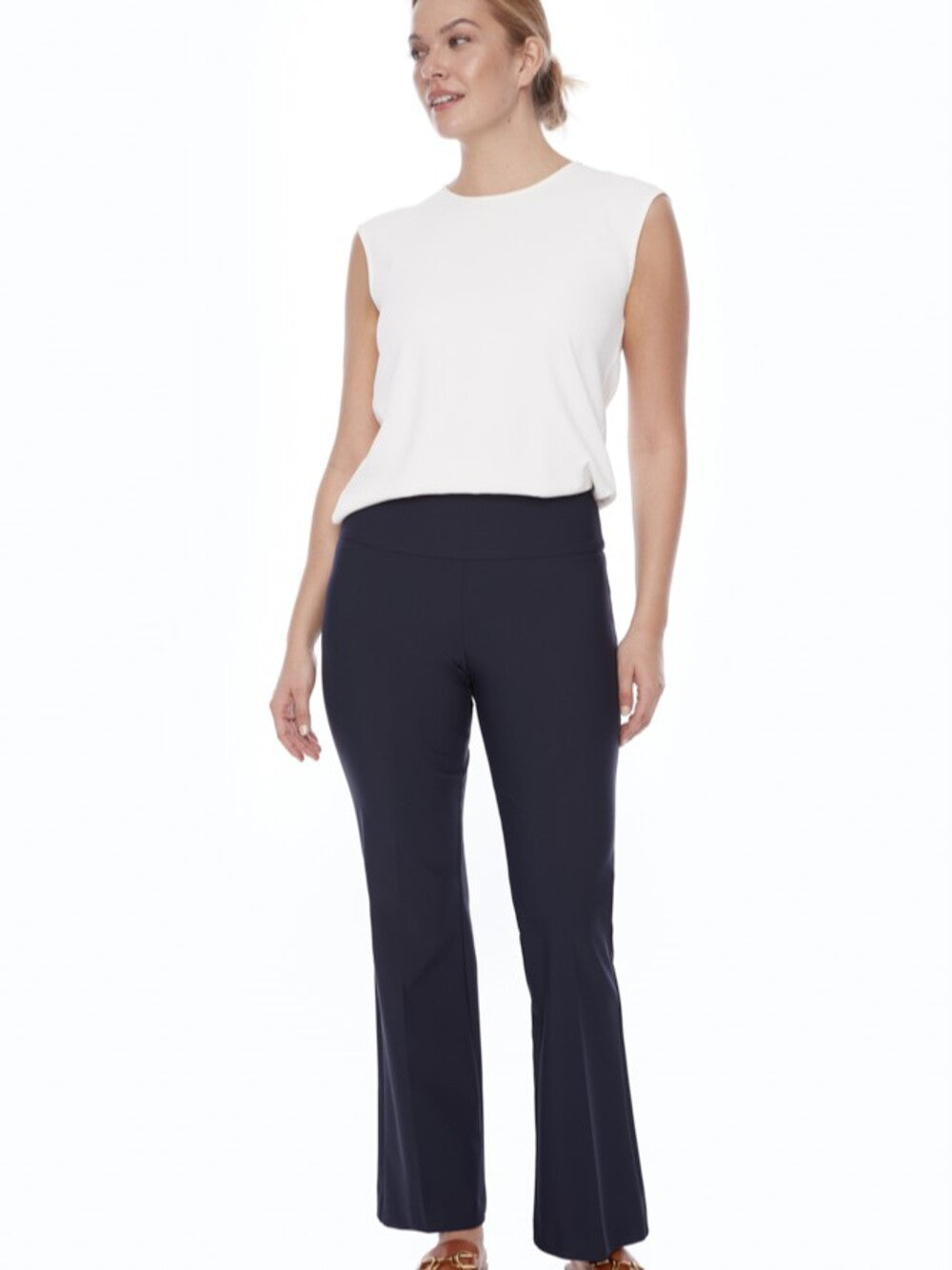Up Precision Ponte Slim Boot 31" Pant in navy by Up styled with a white sleeveless top and brown sandals.