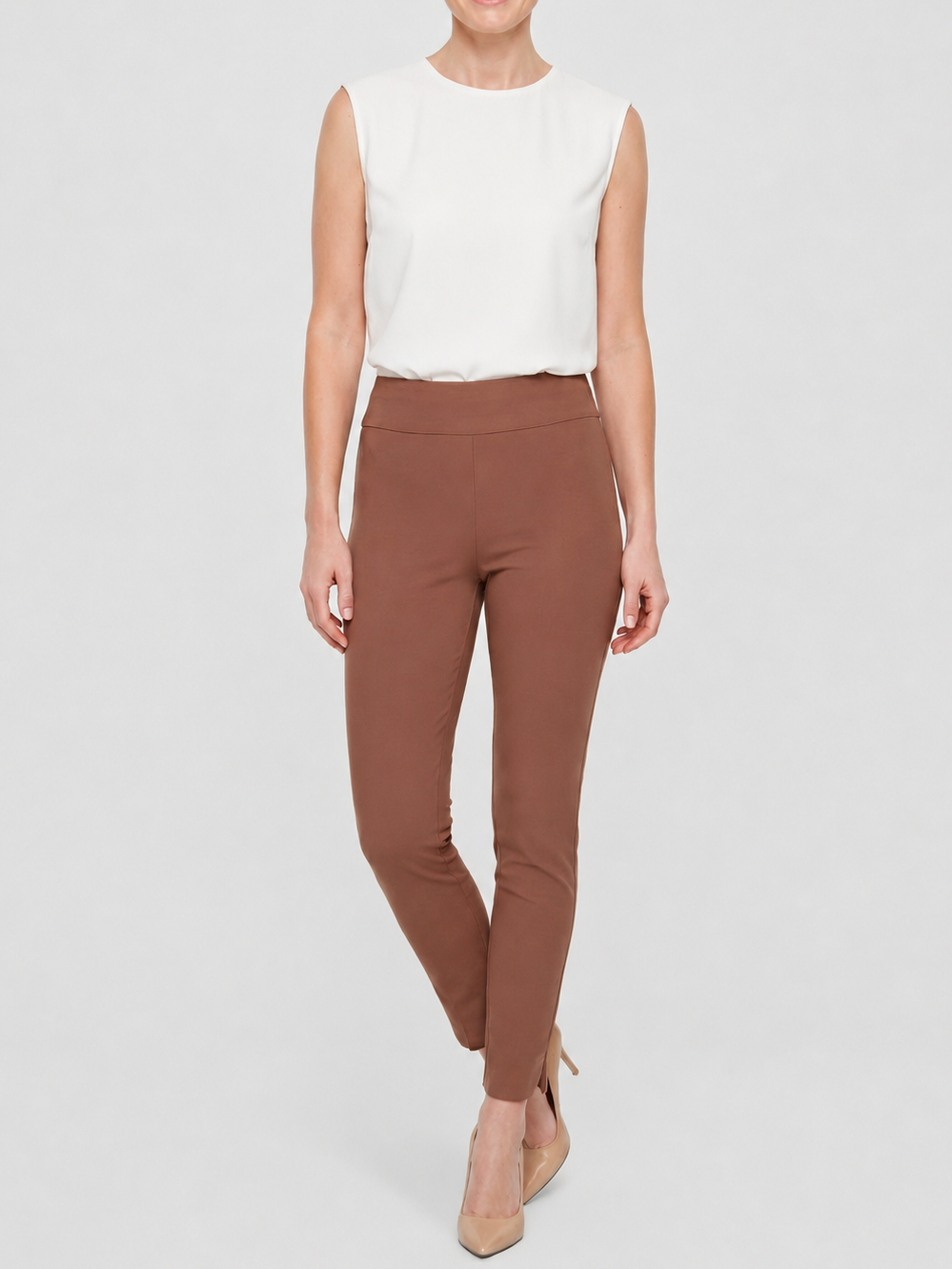 Up! New Warp 28" Petal Pants" by Up in brown slim fit style paired with white sleeveless top and beige heels
