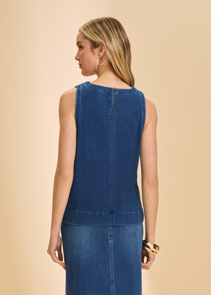 Back view of a sleeveless blue denim top paired with a matching denim skirt and gold hoop earrings.