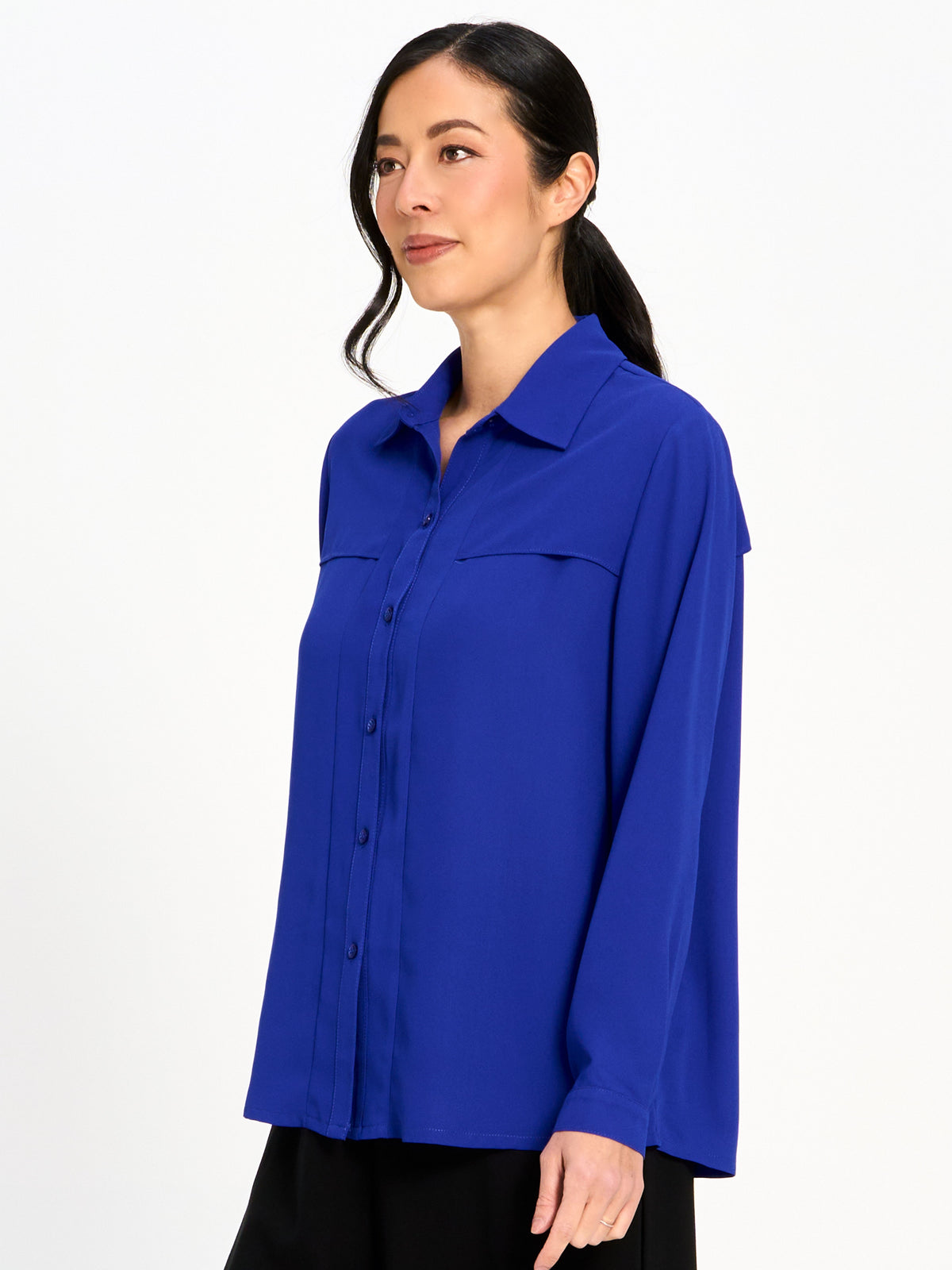 Elegant royal blue long-sleeve button-down blouse with collar and flap details on a plain white background