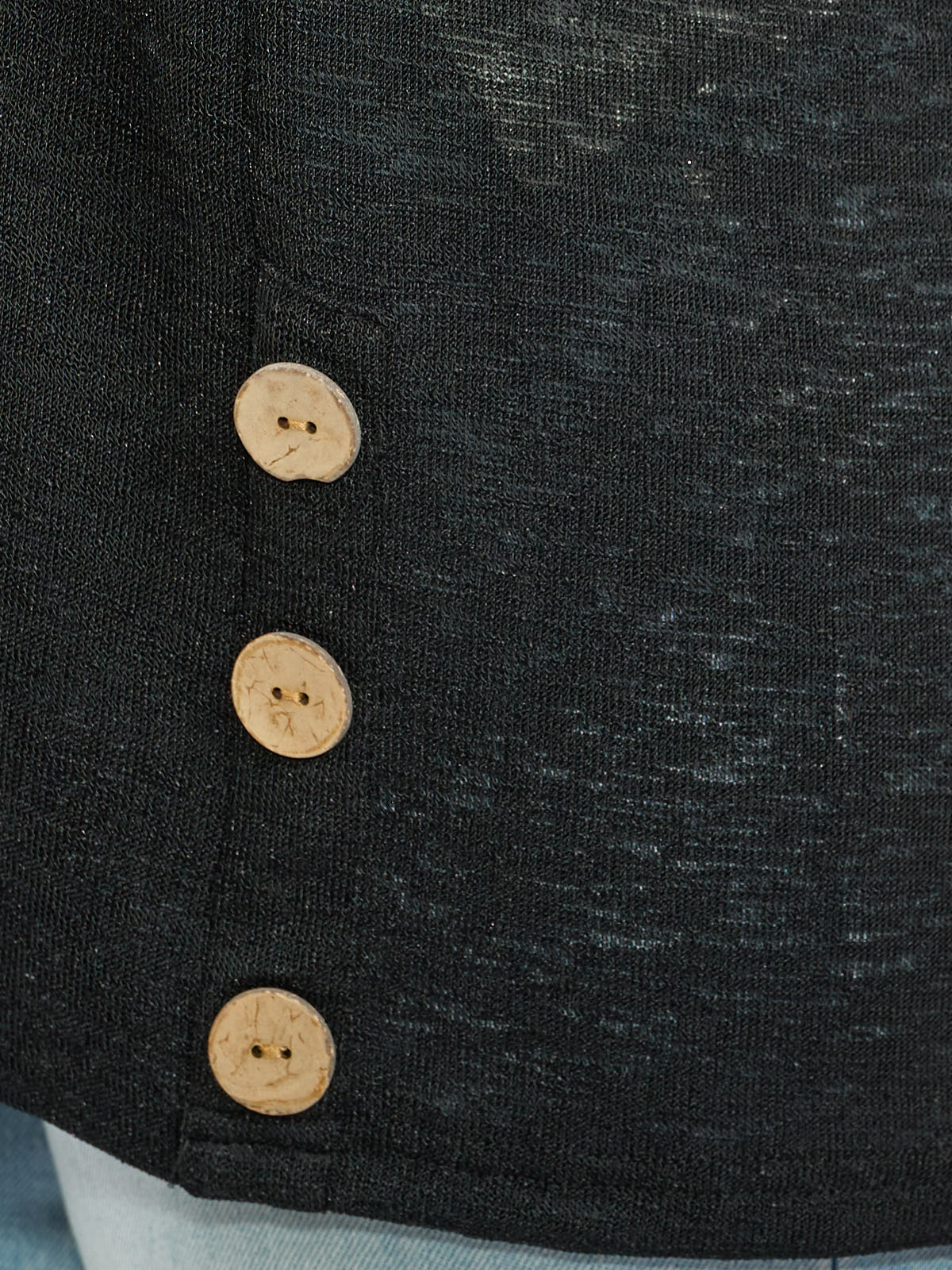 Close-up of black Linen Side Button Slub Cardigan by Nulook Fashions featuring natural wood buttons on soft textured fabric.