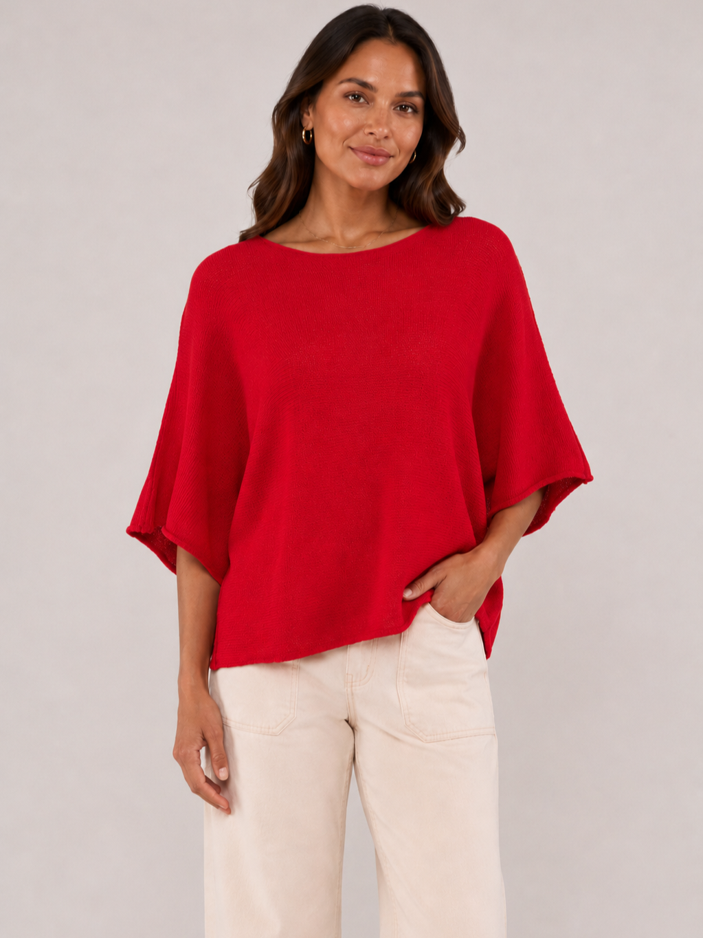Pop Me Over Oversized 3/4 Sleeve Knit Top by Plum Loco in red, styled with beige pants, elegant sweater top.