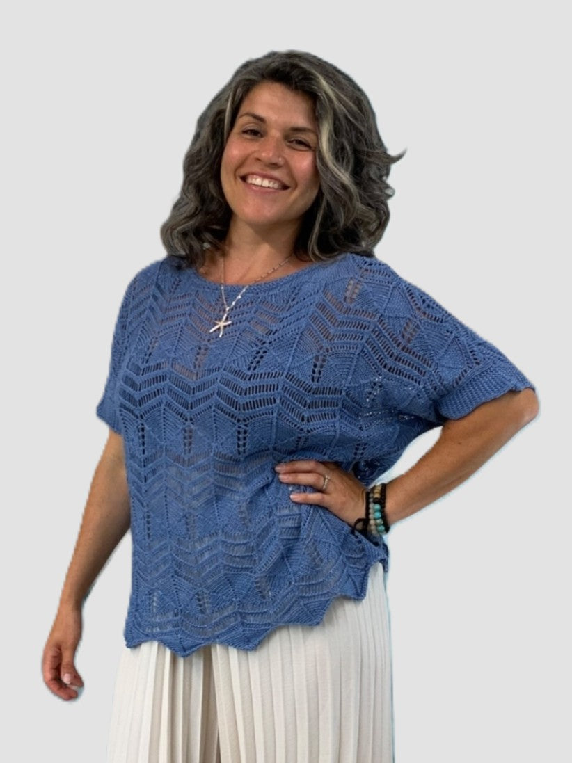 Blue Crochet Popover Short Sleeve Oversized Knit Top by Plum Loco with a textured pattern and relaxed fit style.