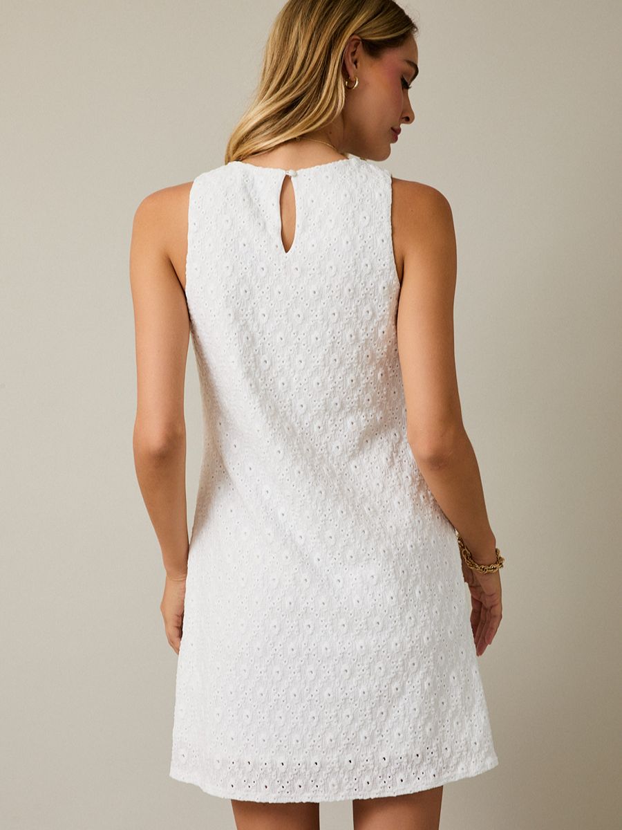 Back view of white eyelet sleeveless Gilli Lacey Dress with keyhole detail and subtle floral texture by Gilli.