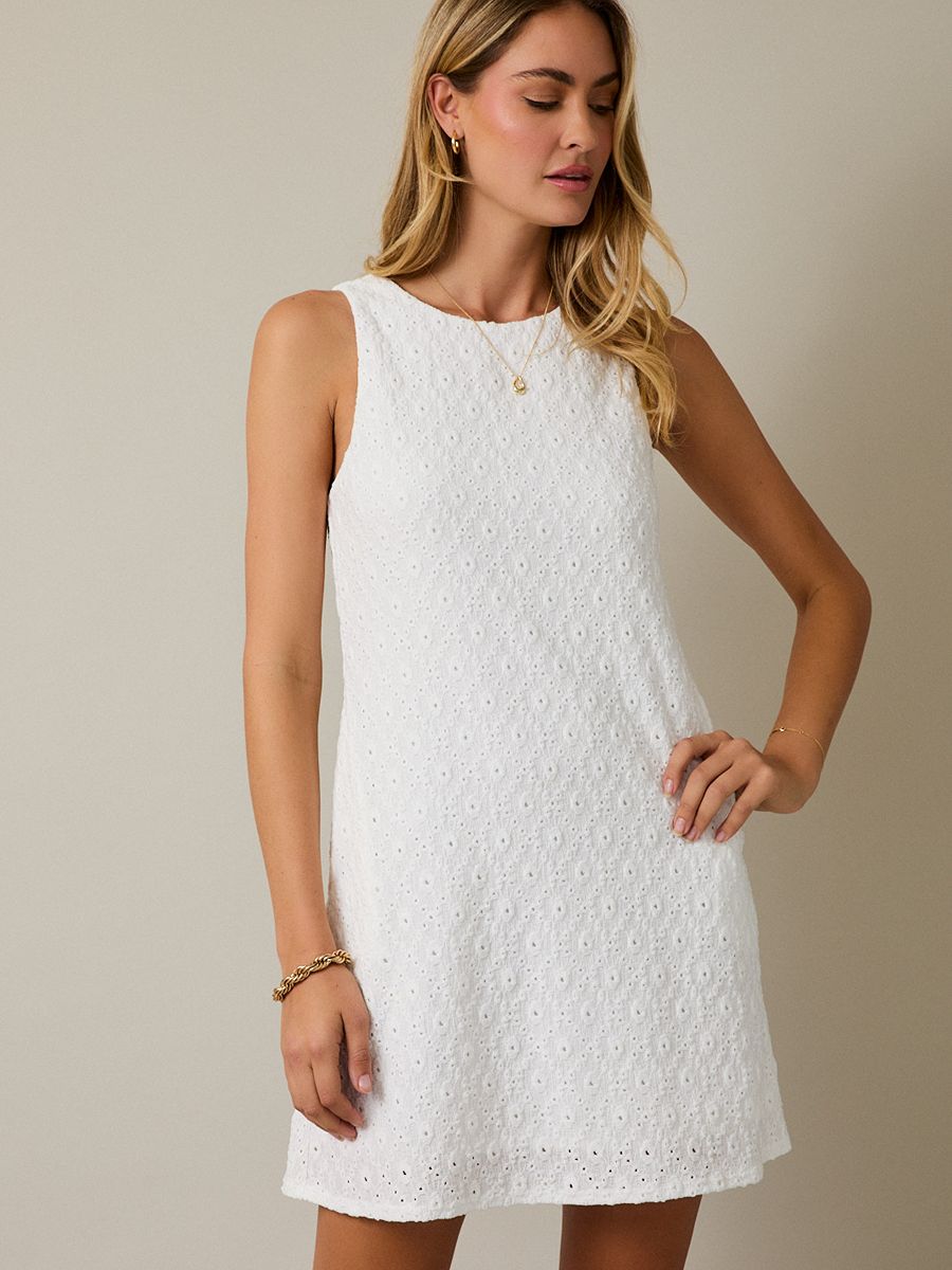 White sleeveless eyelet dress with textured floral pattern and round neckline, Gilli Lacey Dress by Gilli