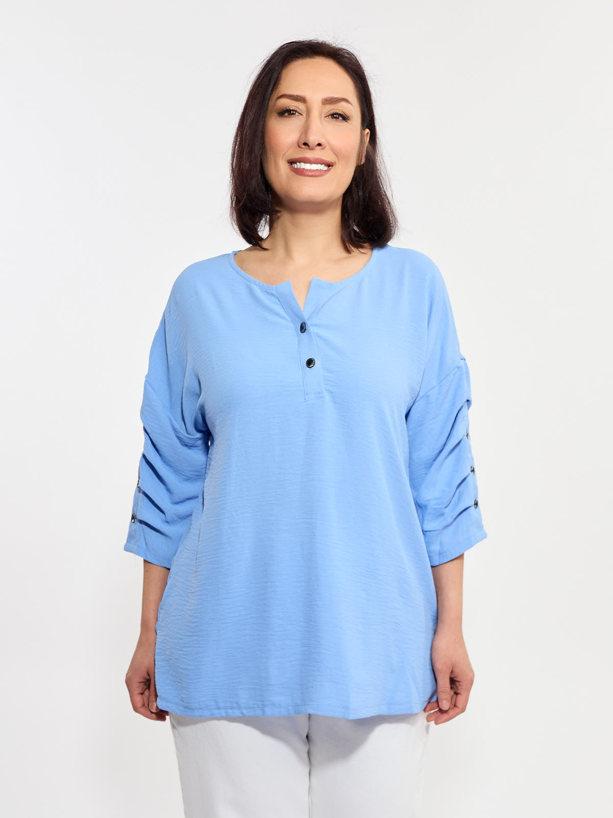 Creation Krinkle Button Tuck Sleeve Blouse by Creations in soft sky blue with button details and relaxed fit top