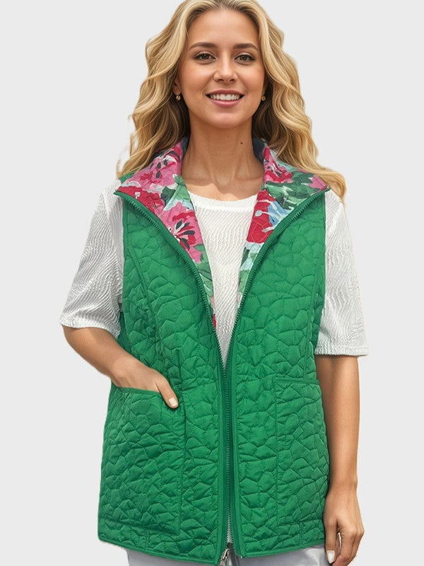 Green quilted vest with floral inner lining worn over a white short-sleeve textured top