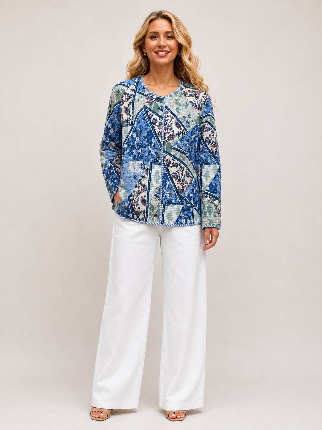Creation Floral Quilted Jacket by Creations in blue floral print, styled with white wide-leg pants, lightweight outerwear jacket.