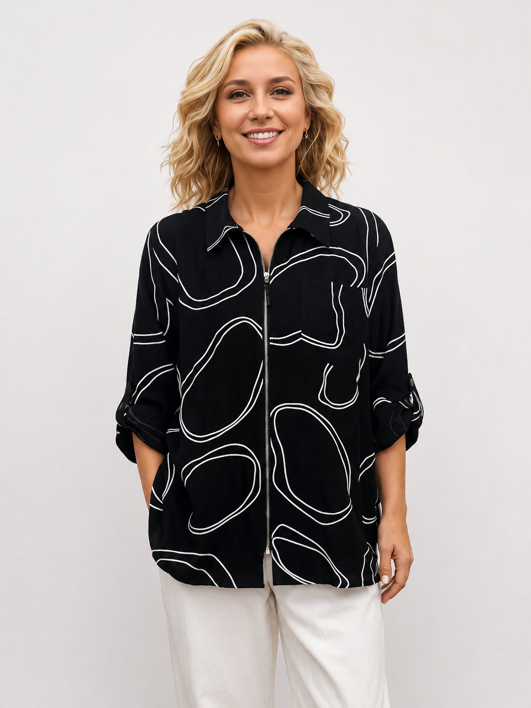 Creation JR Cobbles Zip Jacket by Creations in black with white abstract patterns, featuring a front zipper and rolled sleeves.