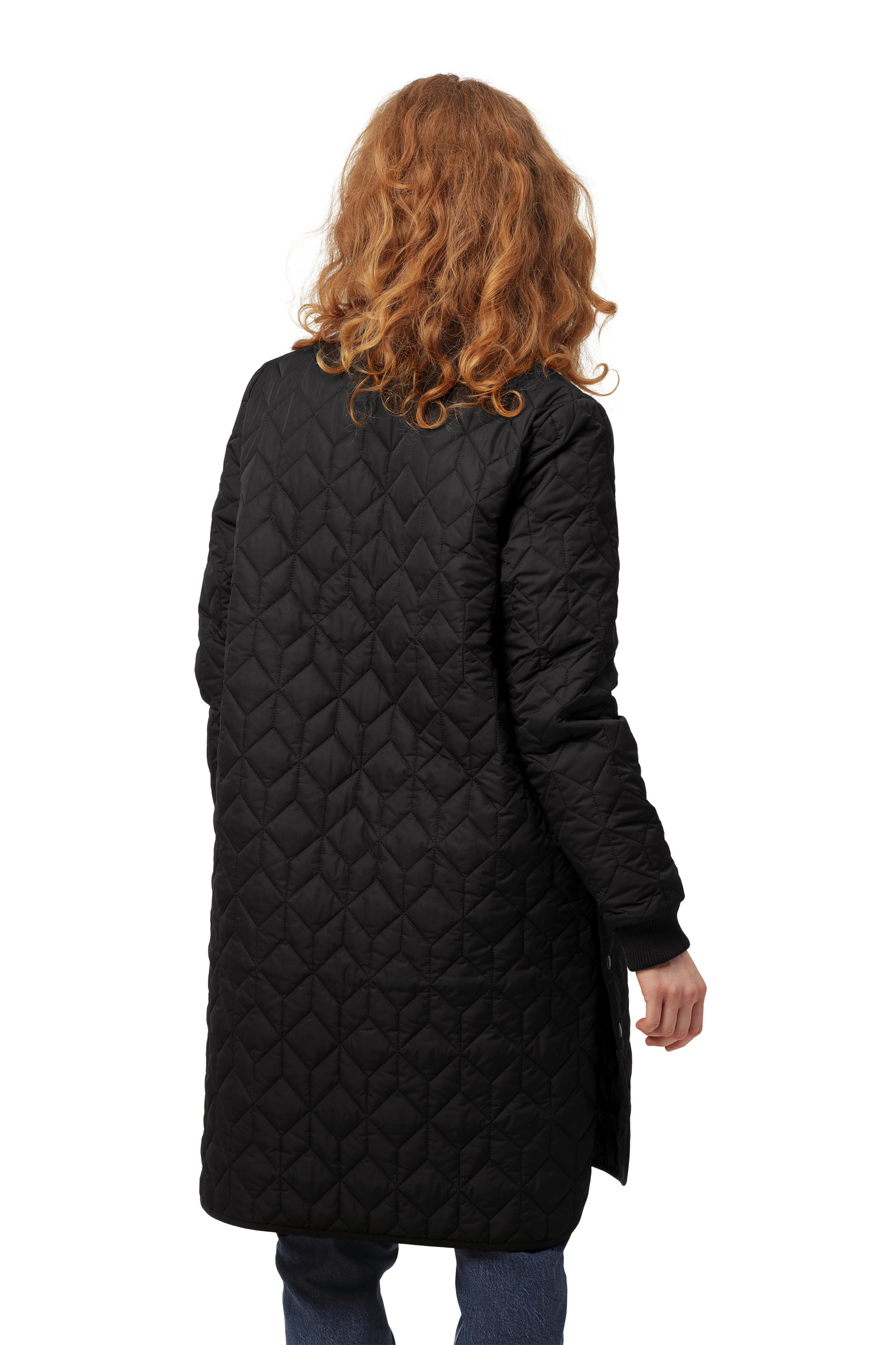 Back view of Ilse Jacobsen Quilted Coat in black with diamond stitching, styled with casual blue jeans by Ilse Jacobsen.