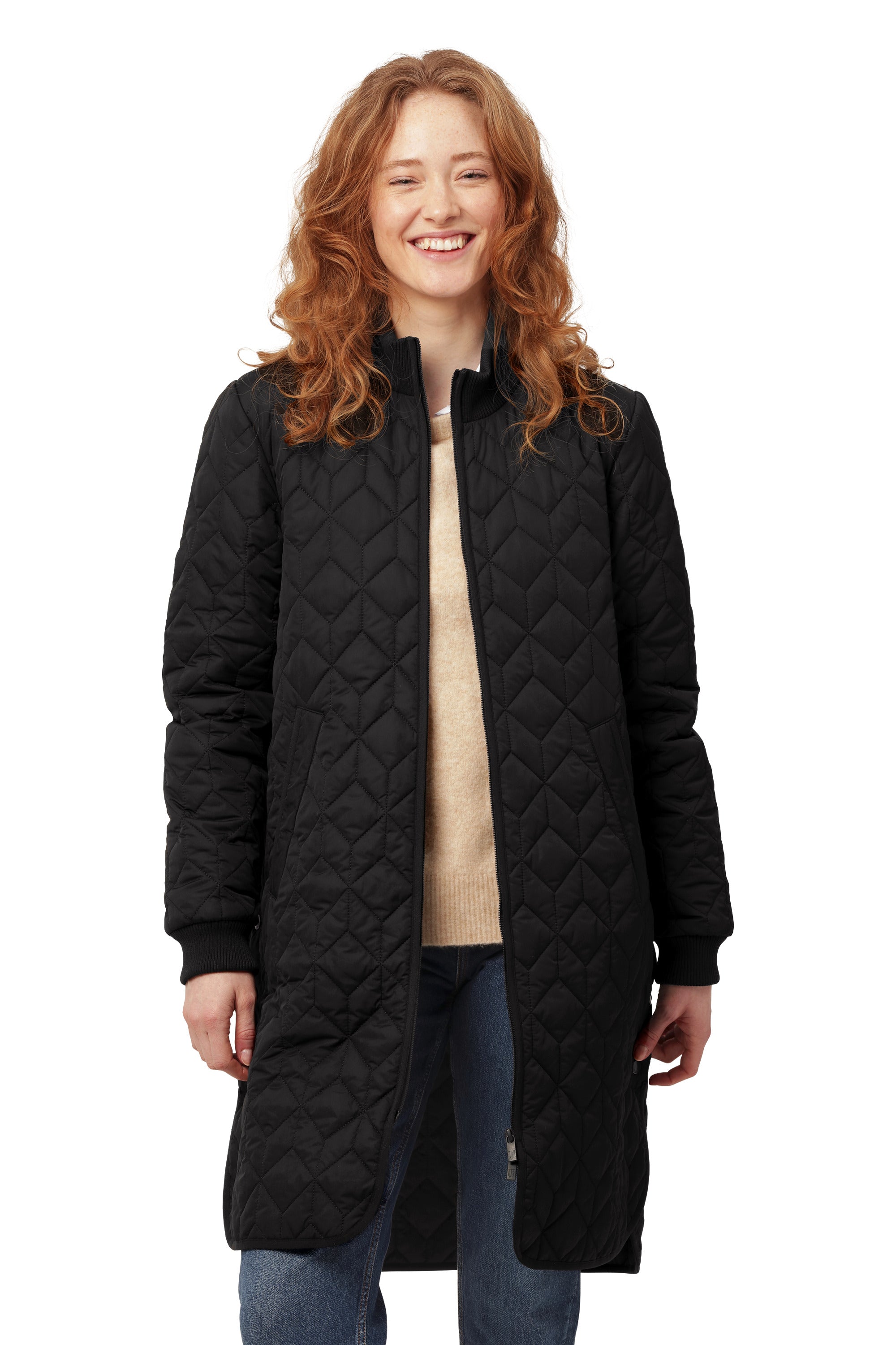 Black quilted Ilse Jacobsen Quilted Coat styled over casual sweater and jeans, featuring a long silhouette and zip closure.