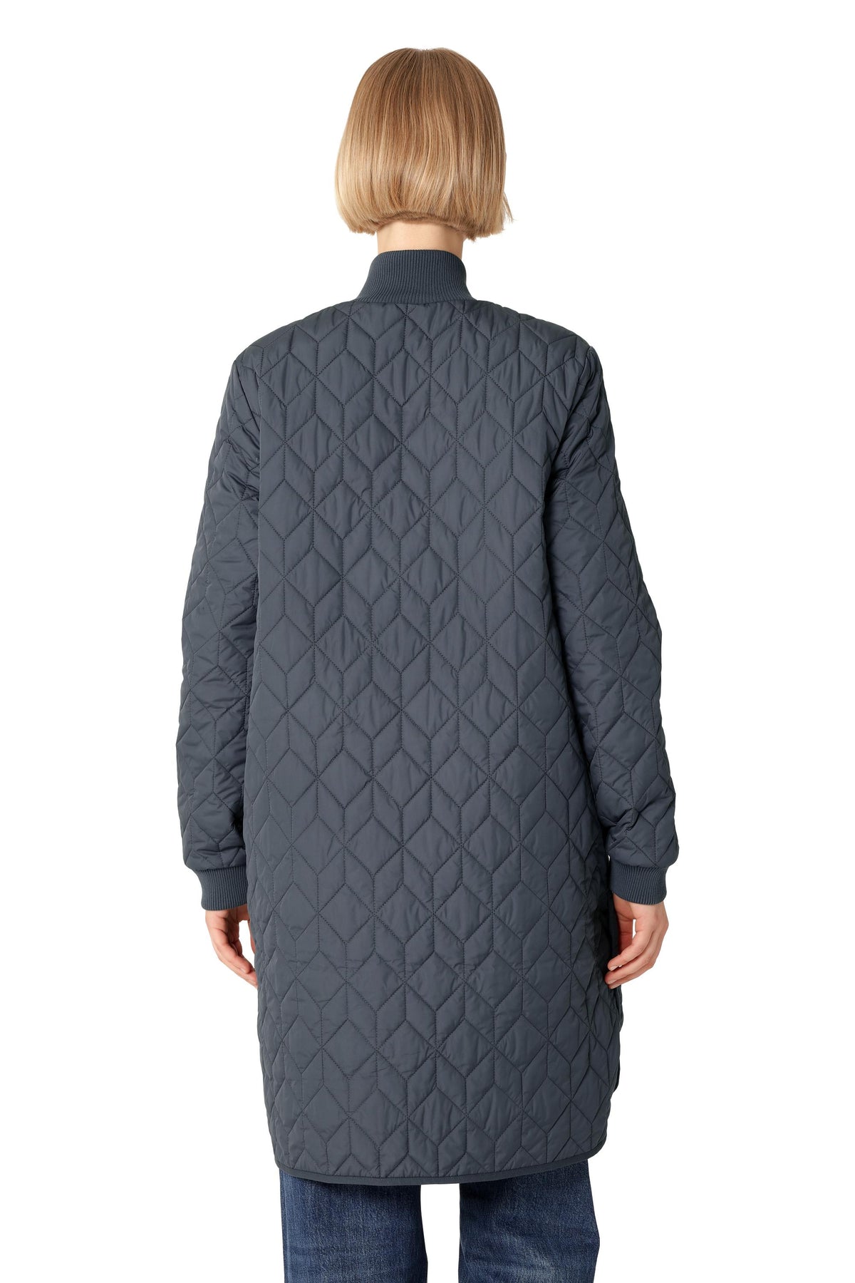 Ilse Jacobsen Quilted Coat in navy, featuring a geometric pattern and ribbed cuffs, styled with denim jeans by Ilse Jacobsen.