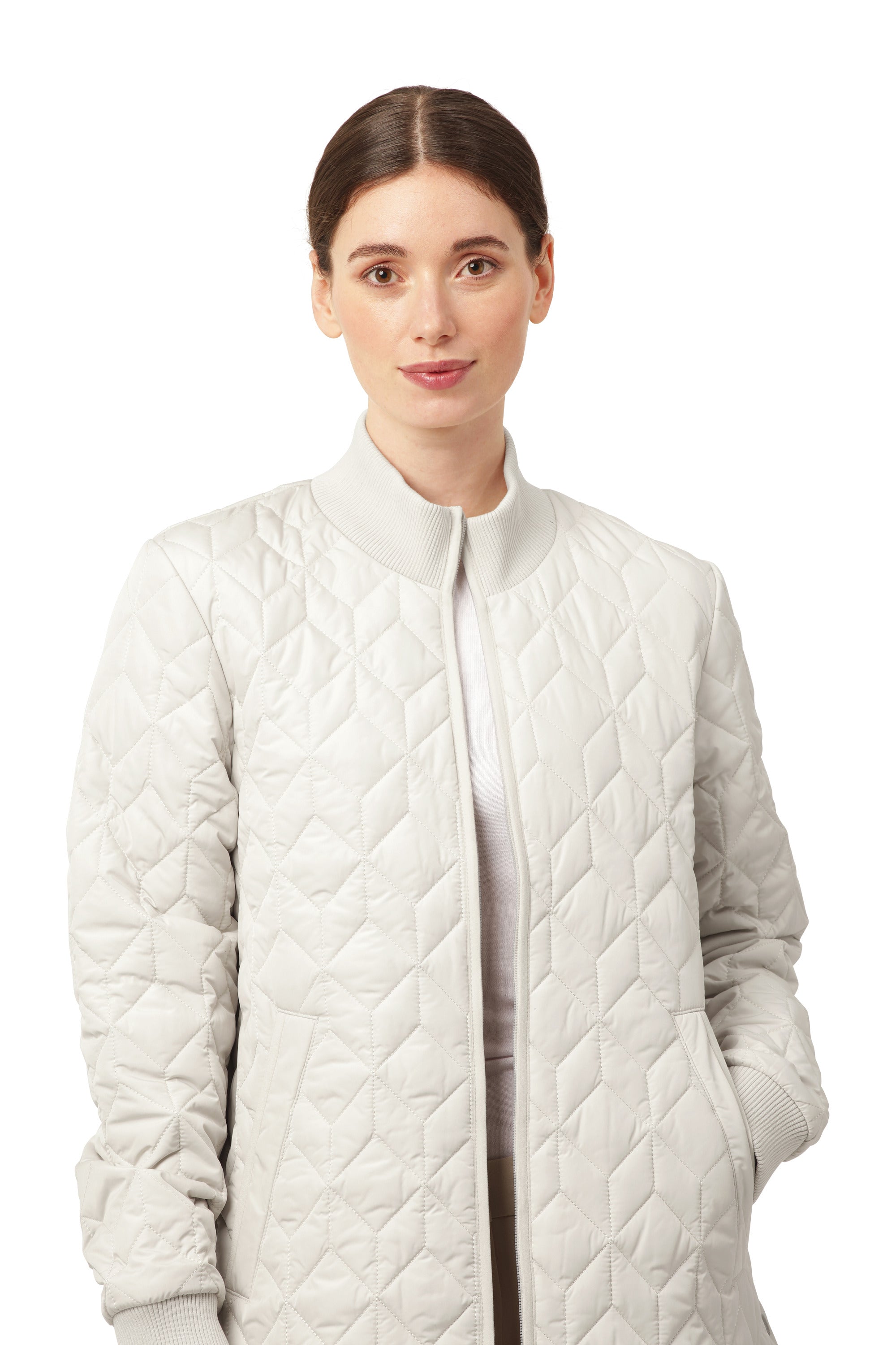 Light cream quilted outerwear styled in an Ilse Jacobsen Quilted Coat with ribbed collar and cuff details