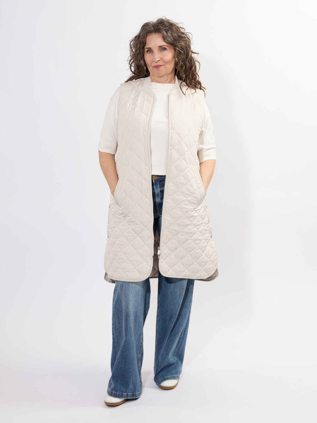 Ilse Jacobsen Quilted Vest in cream worn over a white top paired with wide-leg denim jeans and casual shoes