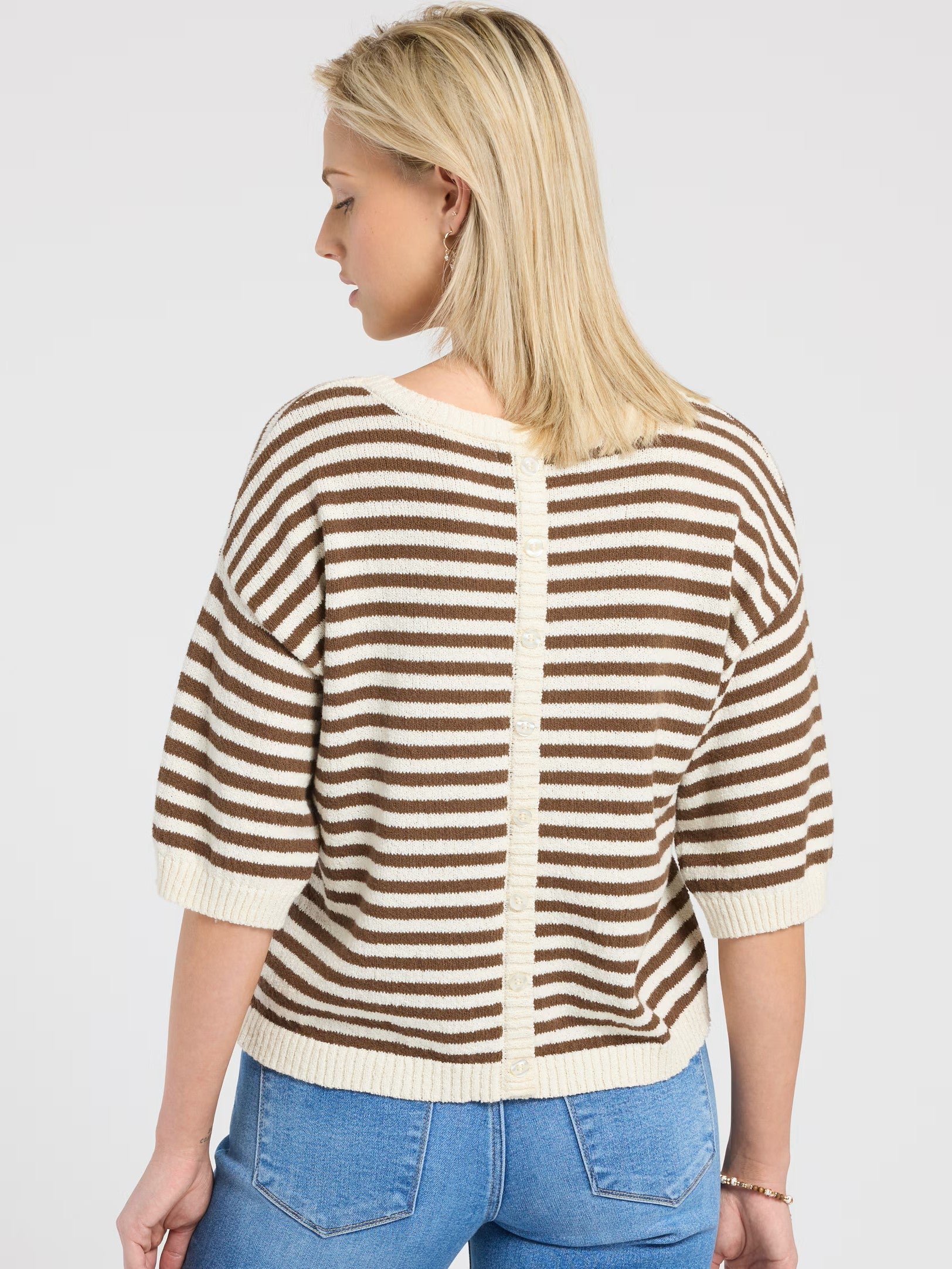 Striped Raw Edge Short Sleeve Crew Top by Mine in brown and cream stripes, styled with blue denim jeans.