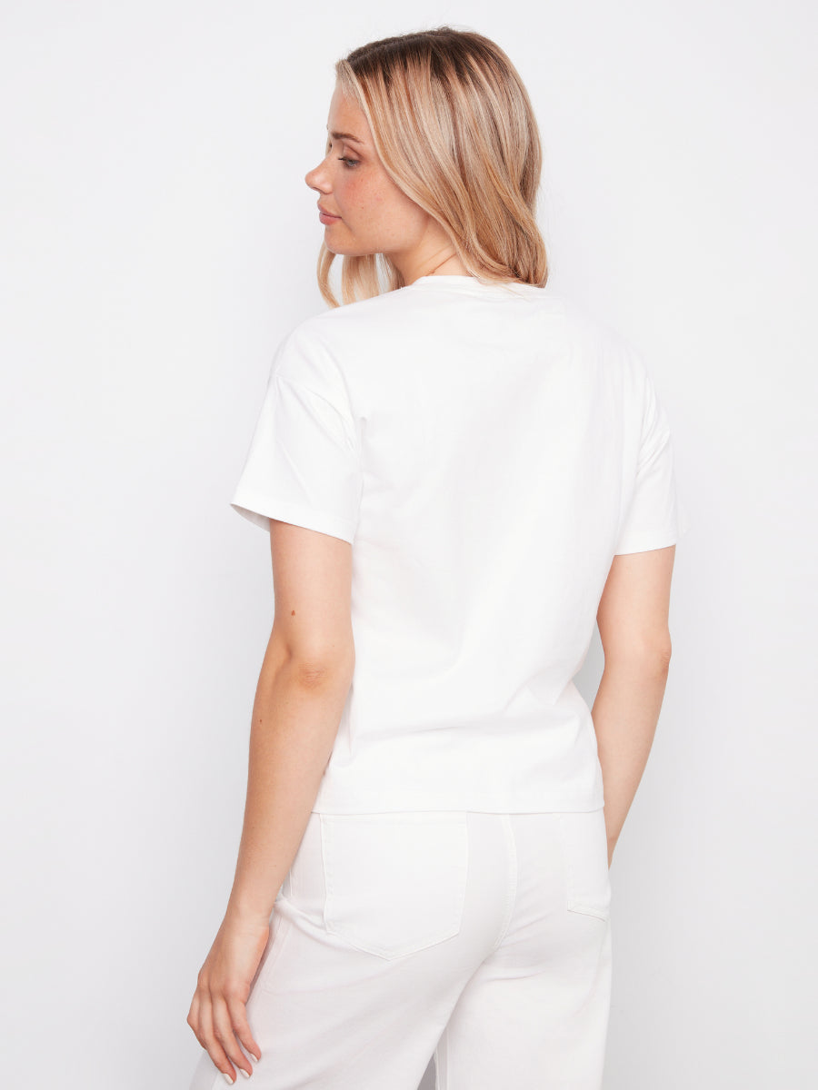 Back view of a white Charlie B Nautical Palm Graphic Cotton T-Shirt by Charlie B on a model against a white background.