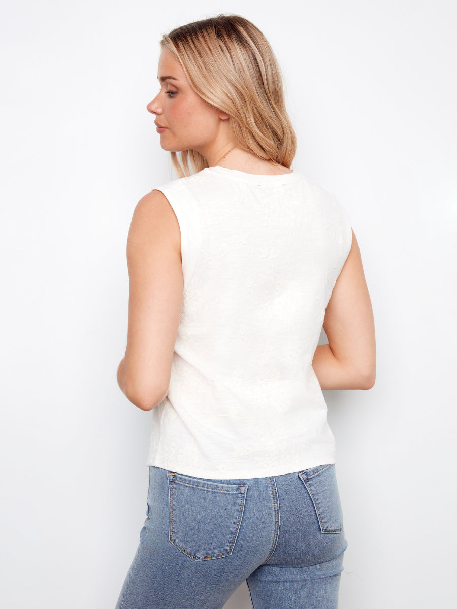 Back view of Charlie B Embroidered Floral Cotton Jersey Top in white, styled with casual denim jeans by Charlie B.