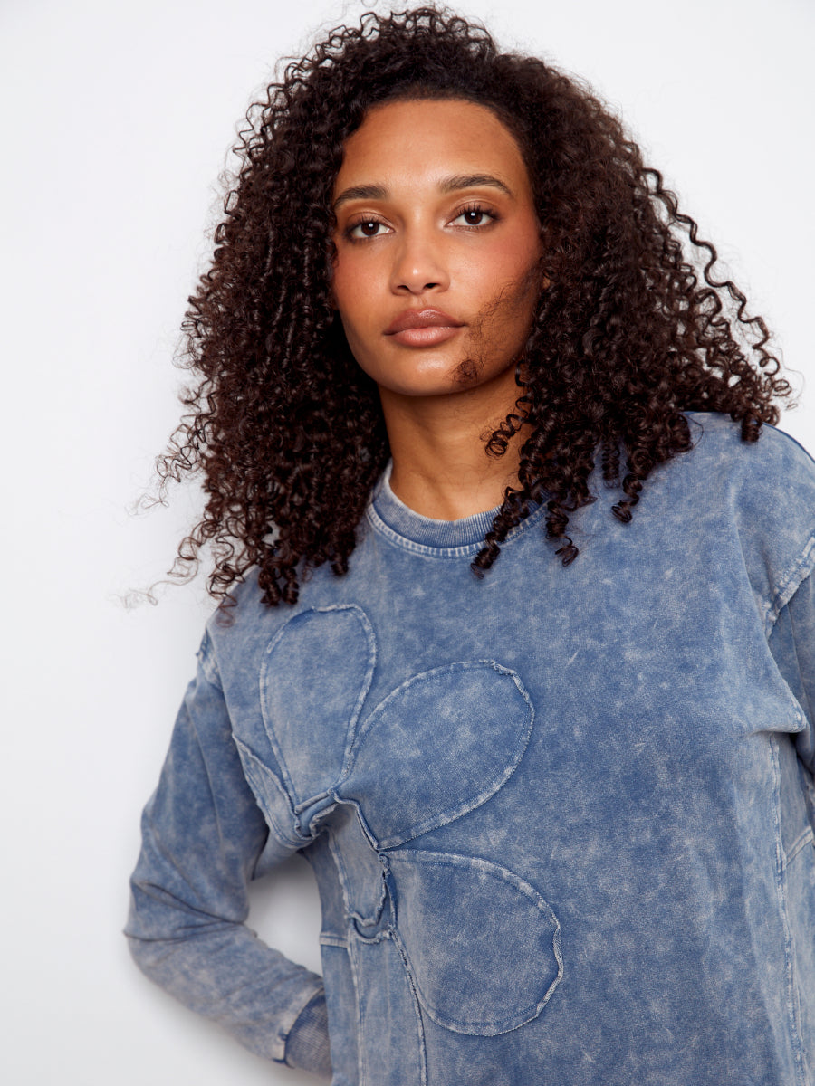 Charlie B Daisy Washed Terry Crew Neck Sweatshirt in faded denim blue with floral applique by Charlie B