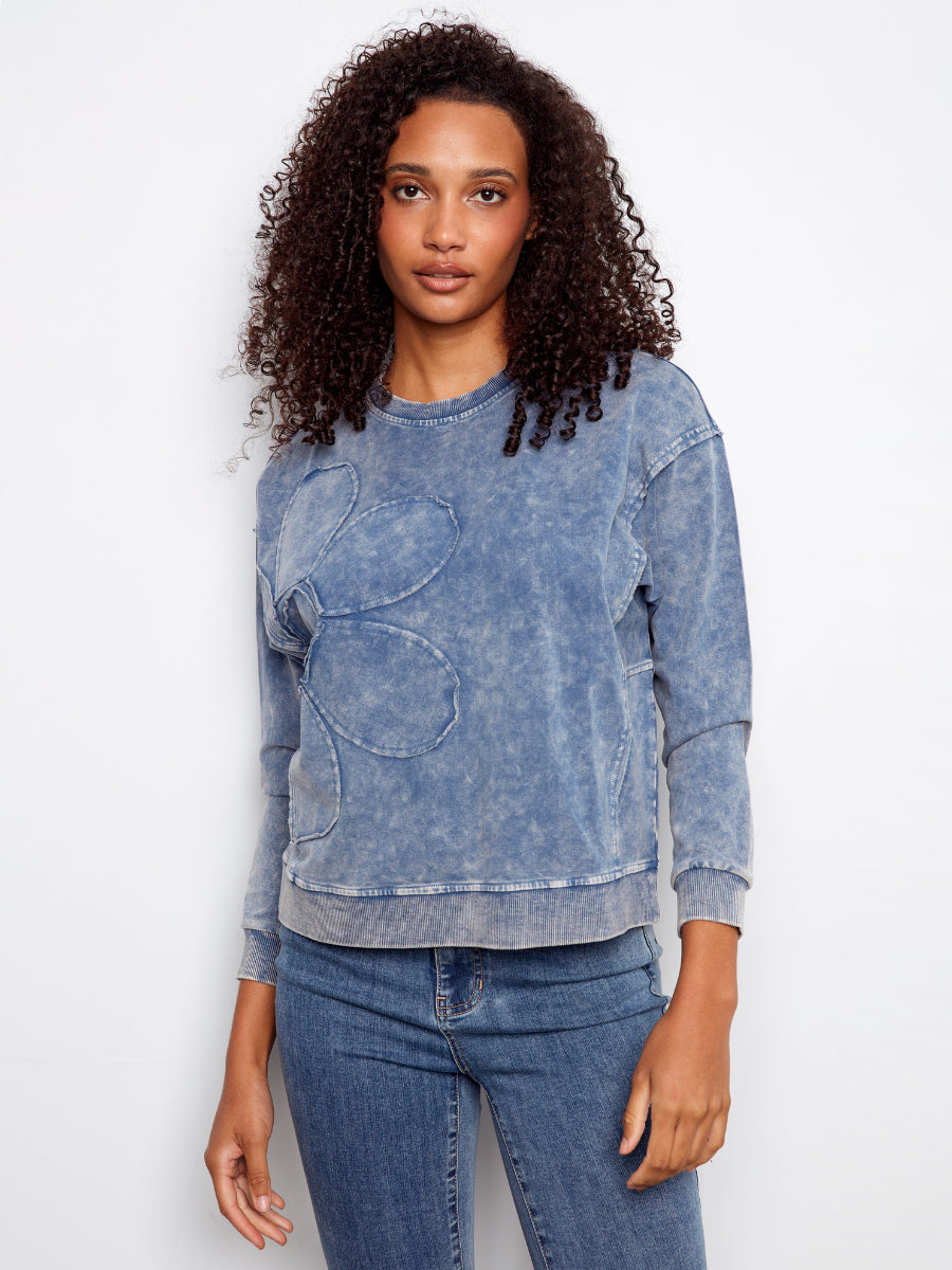 Charlie B Daisy Washed Terry Crew Neck Sweatshirt in washed denim blue with floral stitch detail by Charlie B.
