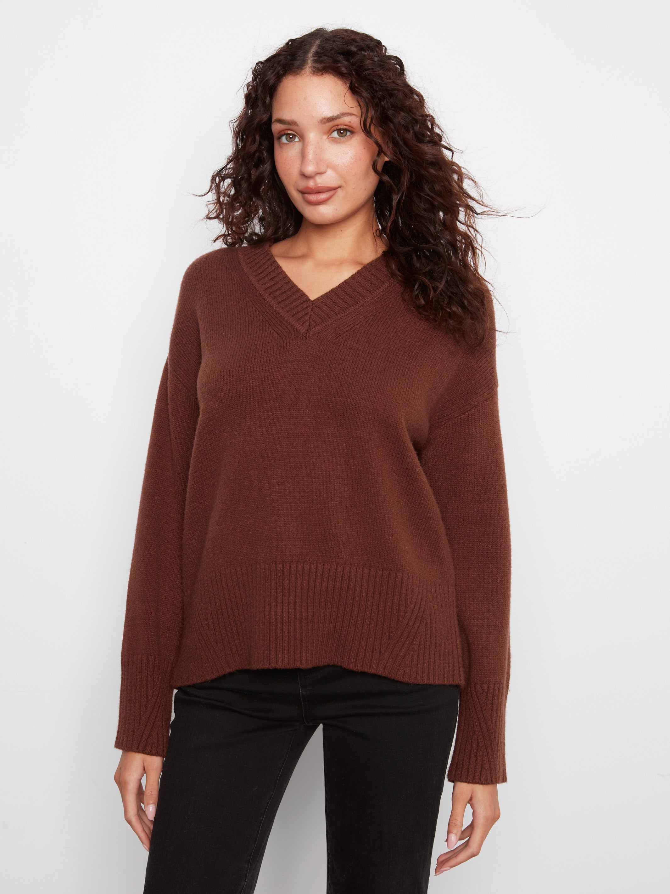 Charlie B Plushy Knit V-Neck Sweater in brown with ribbed cuffs and hem, styled with black pants by Charlie B.