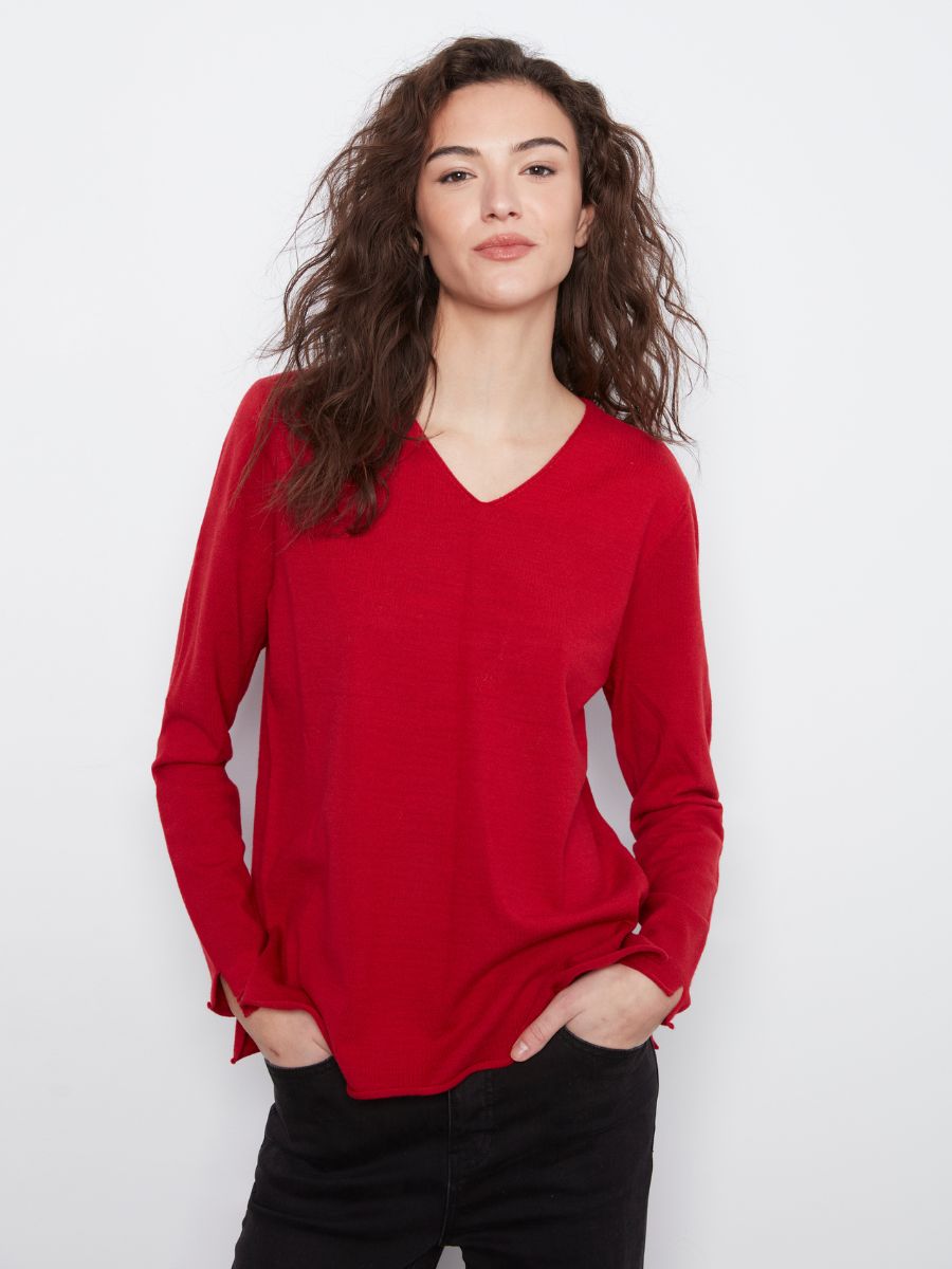 Red V-neck sweater by Charlie B named Charlie B Jenny Plushy V-Neck Sweater, styled with black bottoms.