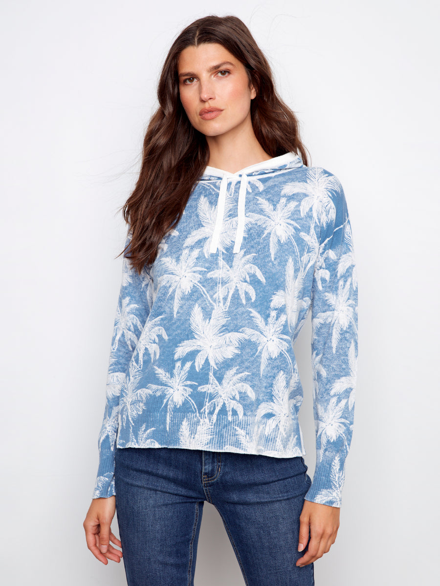 Charlie B Palms Tropical Hooded Pullover Top in blue with white palm print, styled with dark denim jeans by Charlie B