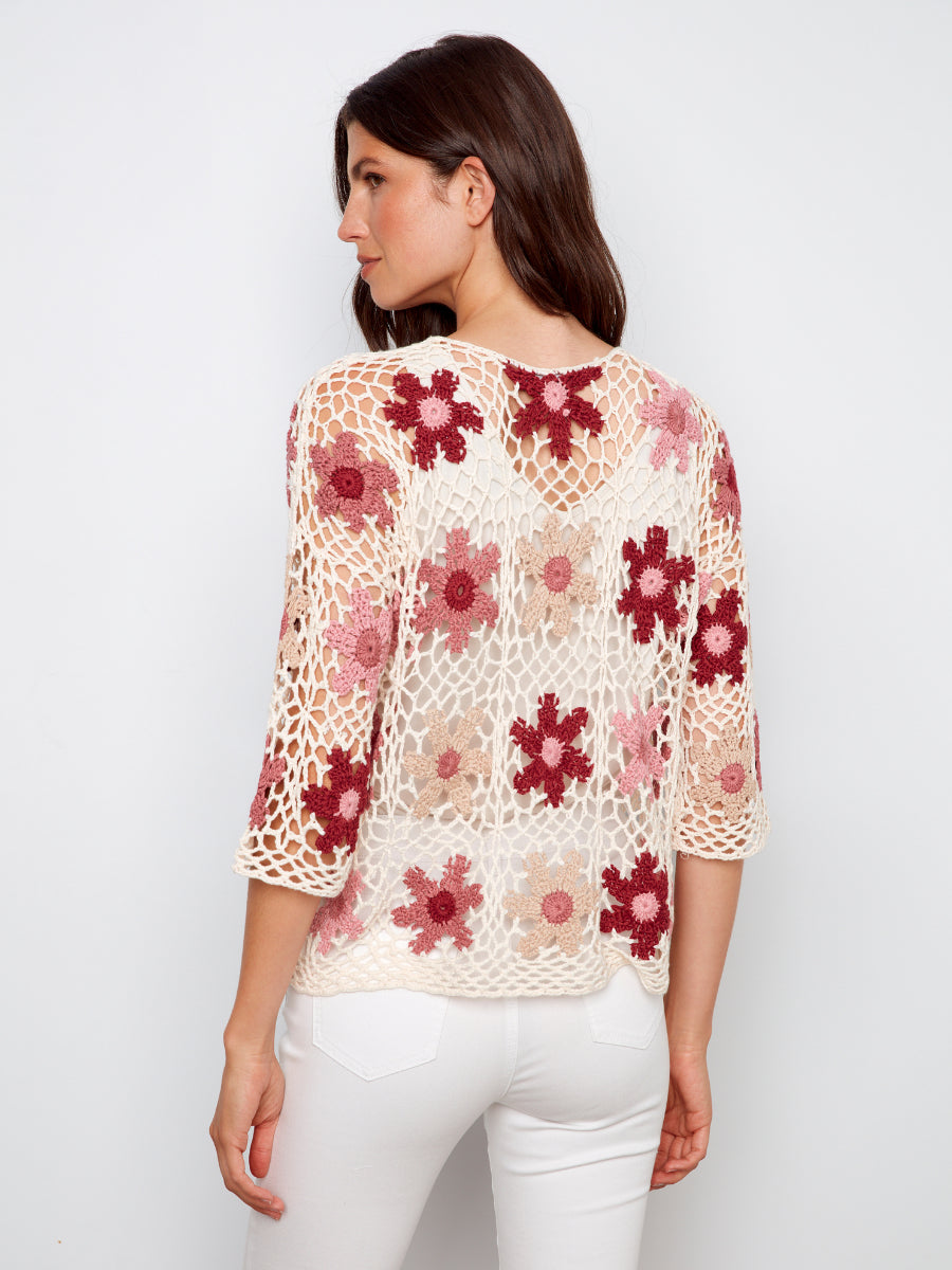 Back view of Charlie B Color My Daisy Three-Quarter Sleeve Crochet Top with floral crochet pattern in warm tones by Charlie B