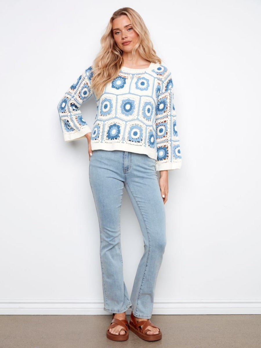 Charlie B Granny Square Floral Crochet Cardigan in cream and blue by Charlie B, styled with light denim jeans and sandals