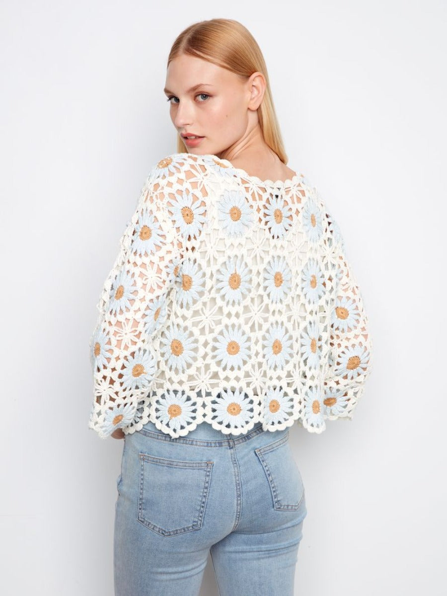Charlie B Floral Crochet Crew Neck Top in white with daisy patterns paired with light blue denim jeans by Charlie B