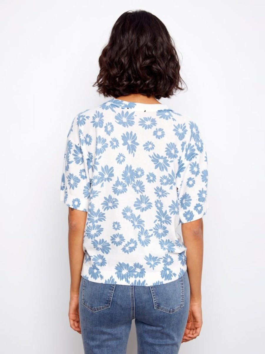 Back view of Charlie B Skylar Petal Crochet Short Sleeve Sweater in white with blue floral crochet pattern by Charlie B