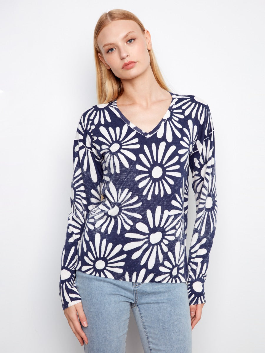 Charlie B Suns Out Ribbed Cotton V-Neck Sweater in navy with white floral print, styled with light denim jeans by Charlie B