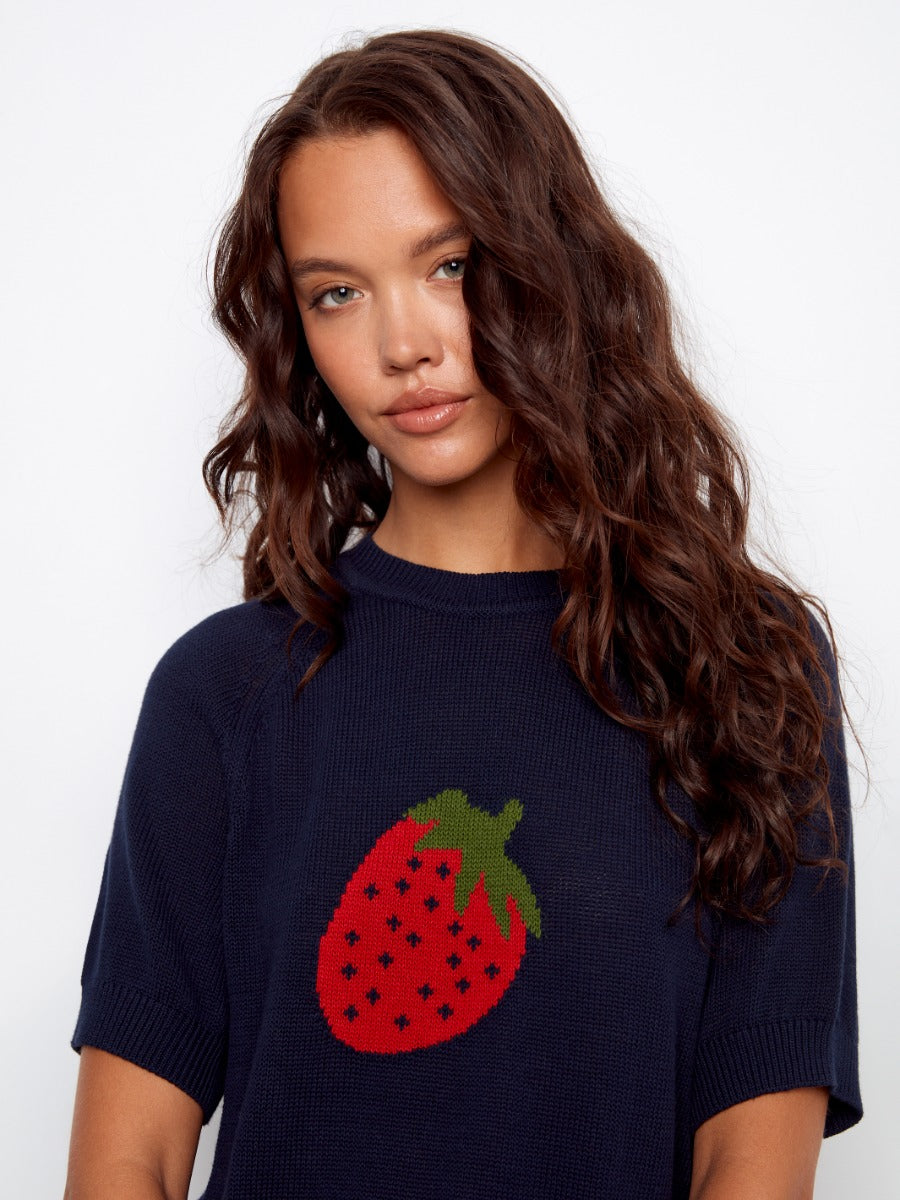 Charlie B Strawberry Short Sleeve Crochet Sweater in navy with a large crochet red strawberry and green leaves design