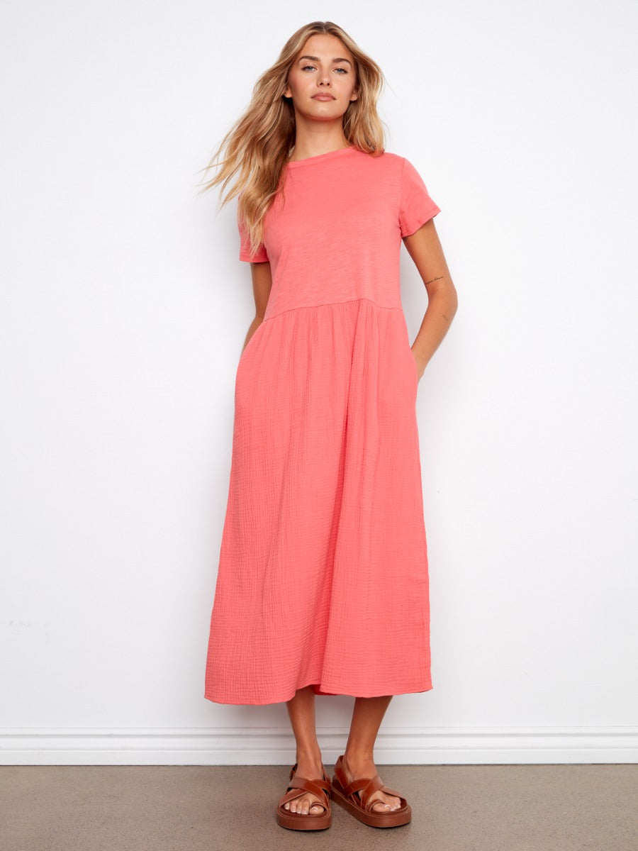 Coral pink Charlie B Bubble Textured Short Sleeve Knit Dress styled with brown sandals against white background.