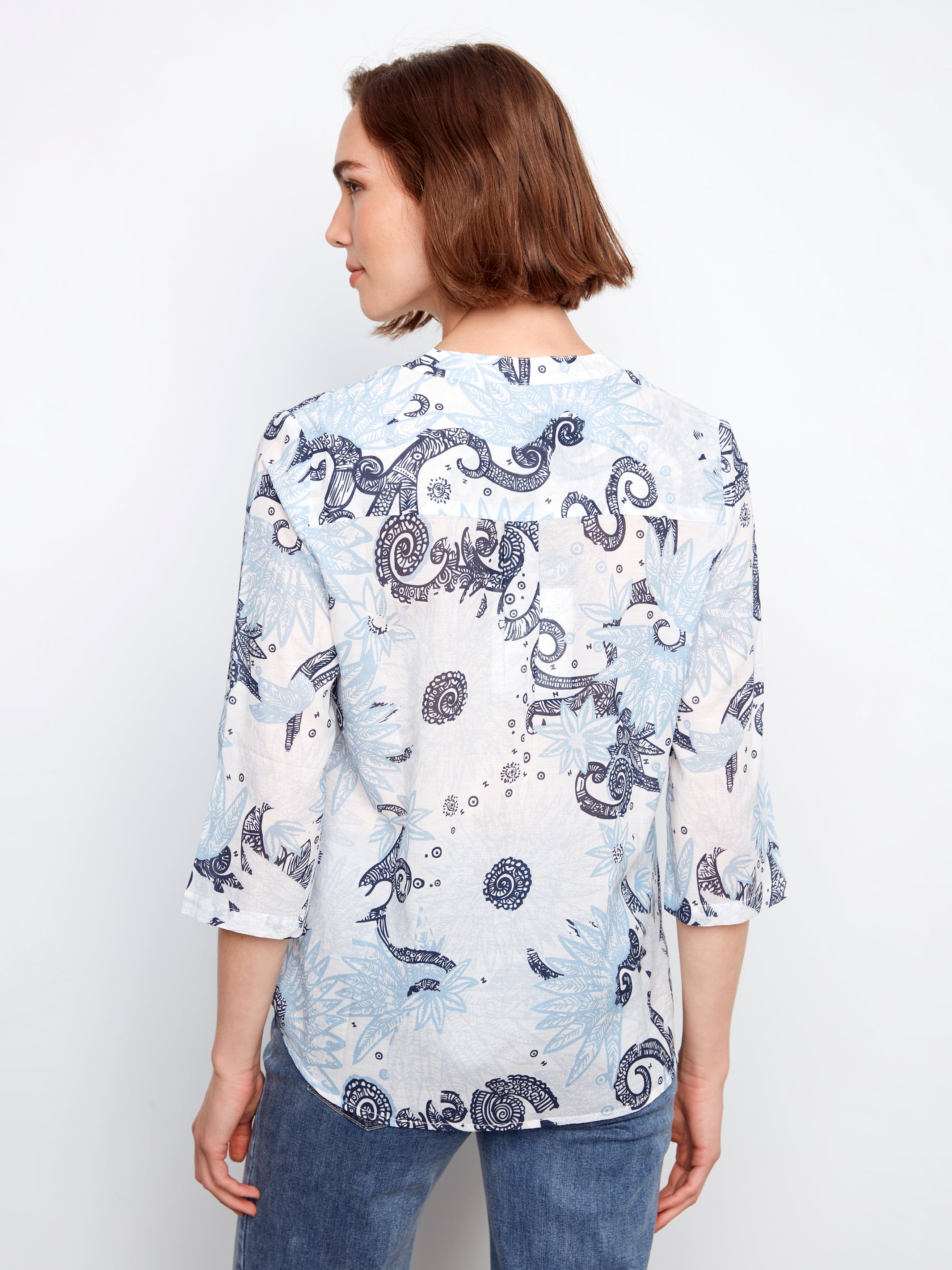 Charlie B Johanna Textured Gauze Roll Sleeve Top in blue and white floral pattern, styled with rolled sleeves