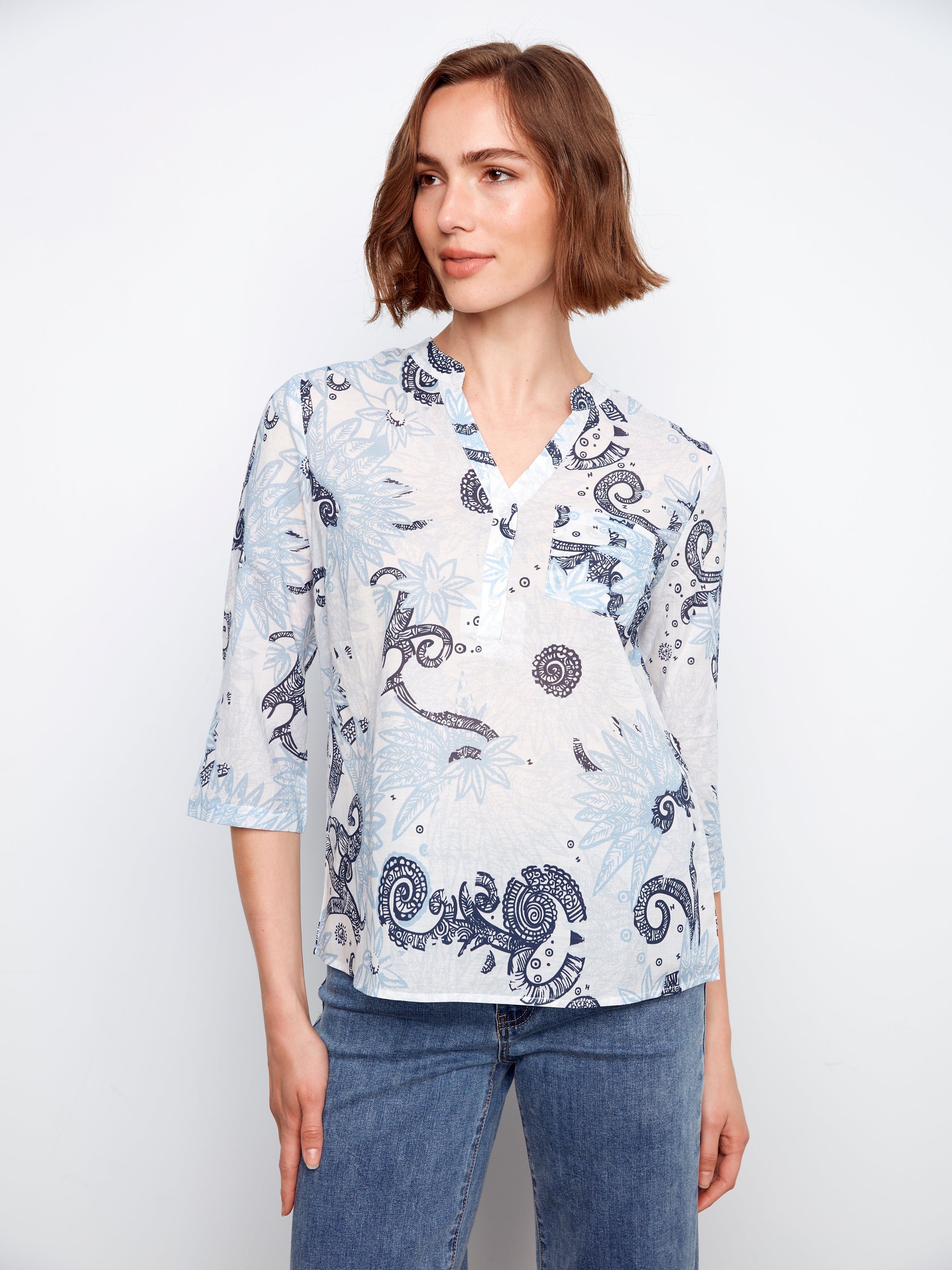Charlie B Johanna Textured Gauze Roll Sleeve Top in light blue floral pattern by Charlie B, styled with jeans.