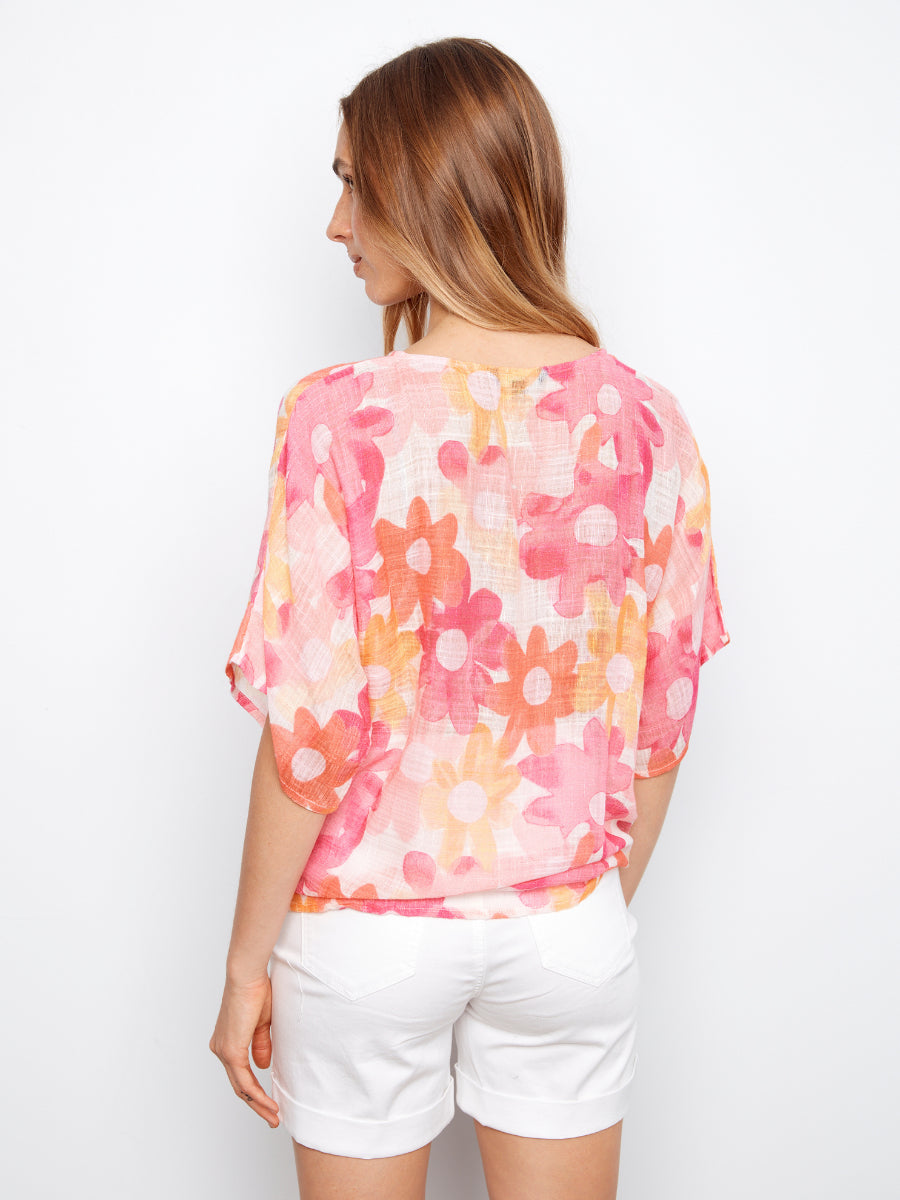 Charlie B Daisy Bright Cotton Gauze Tie Top in pink floral pattern with loose short sleeves and lightweight fabric