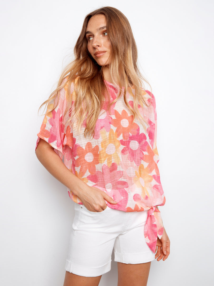 Charlie B Daisy Bright Cotton Gauze Tie Top in pink floral pattern, styled with white shorts, lightweight cotton top.