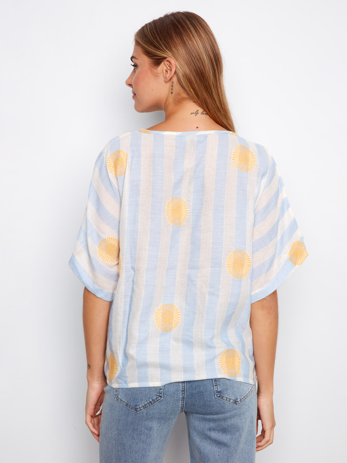 Back view of Charlie B Sunrise Striped Tie Short Sleeve Top in blue and white stripes with yellow sun motifs by Charlie B.