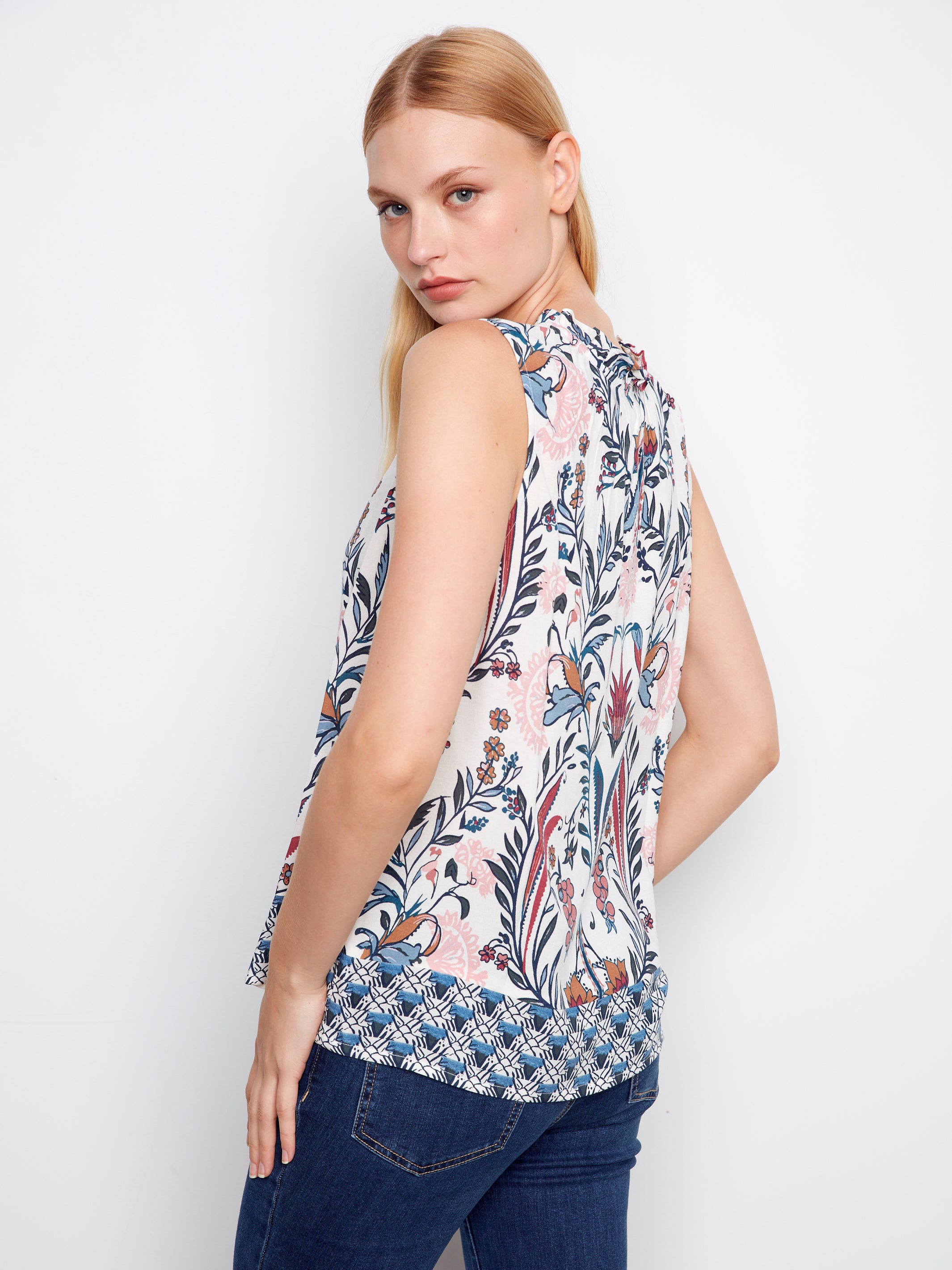 Charlie B Layered or Not Ruffle Sleeveless Top with floral print and ruffle detail, styled with dark denim jeans.