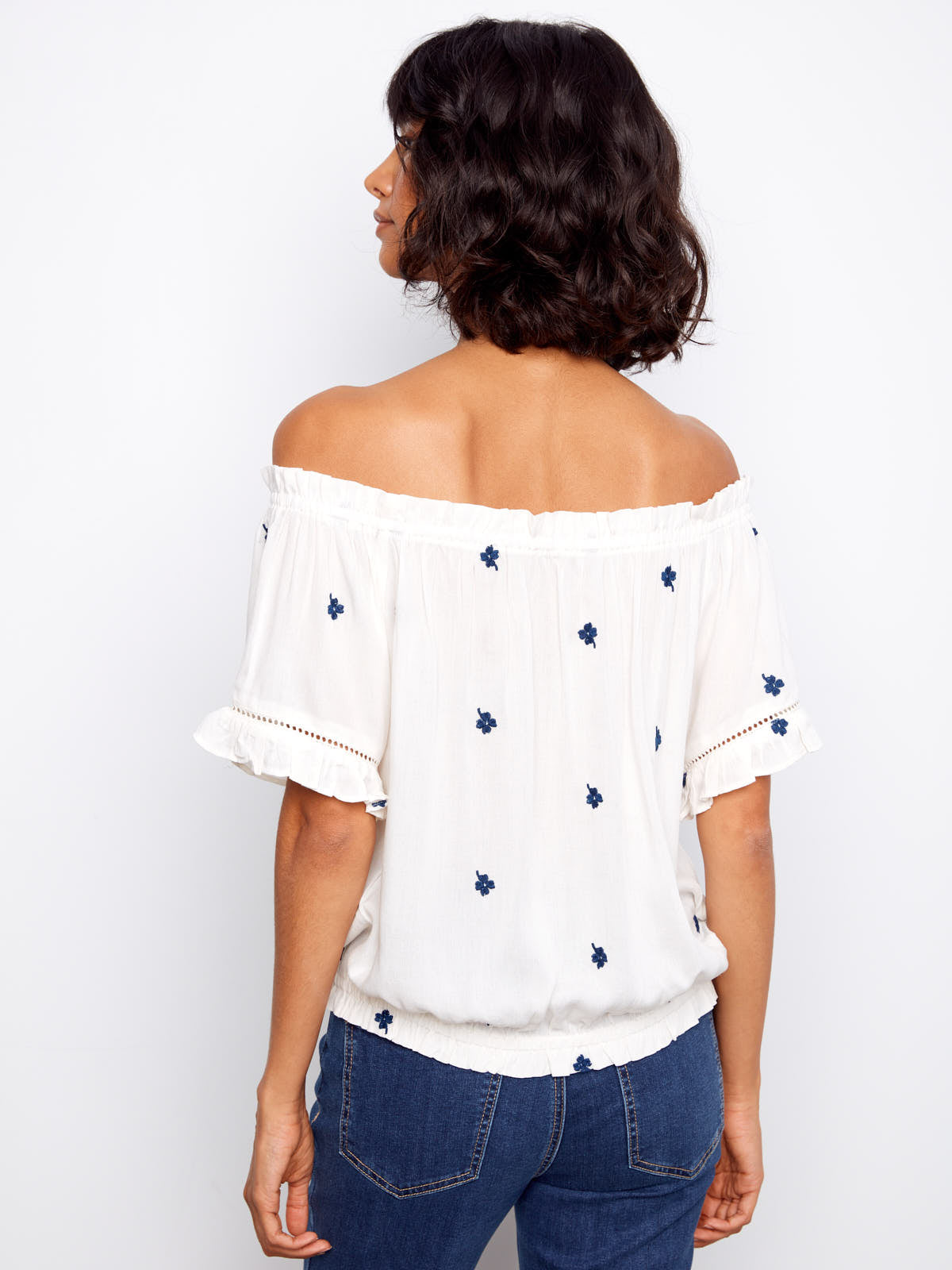 Back view of Charlie B Embroidered Clover Short Sleeve Top in white with navy embroidered clovers by Charlie B