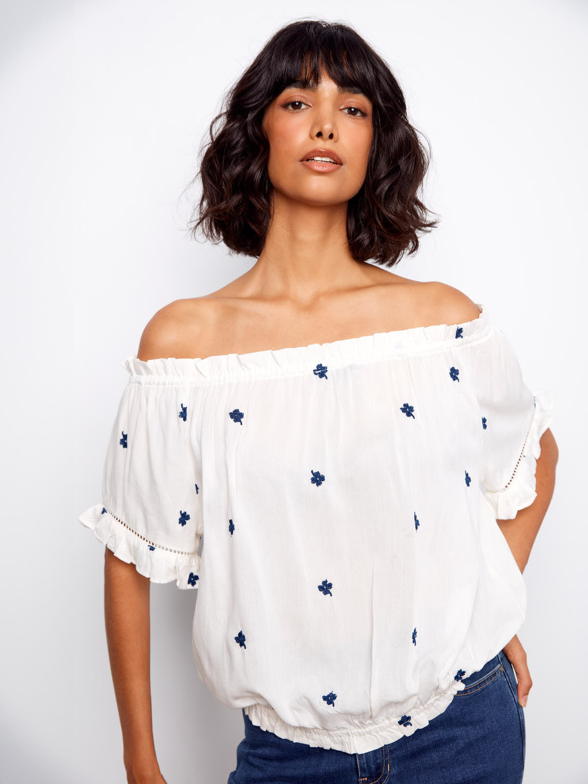 Charlie B Embroidered Clover Short Sleeve Top in white with navy clover embroidery and off-shoulder design by Charlie B