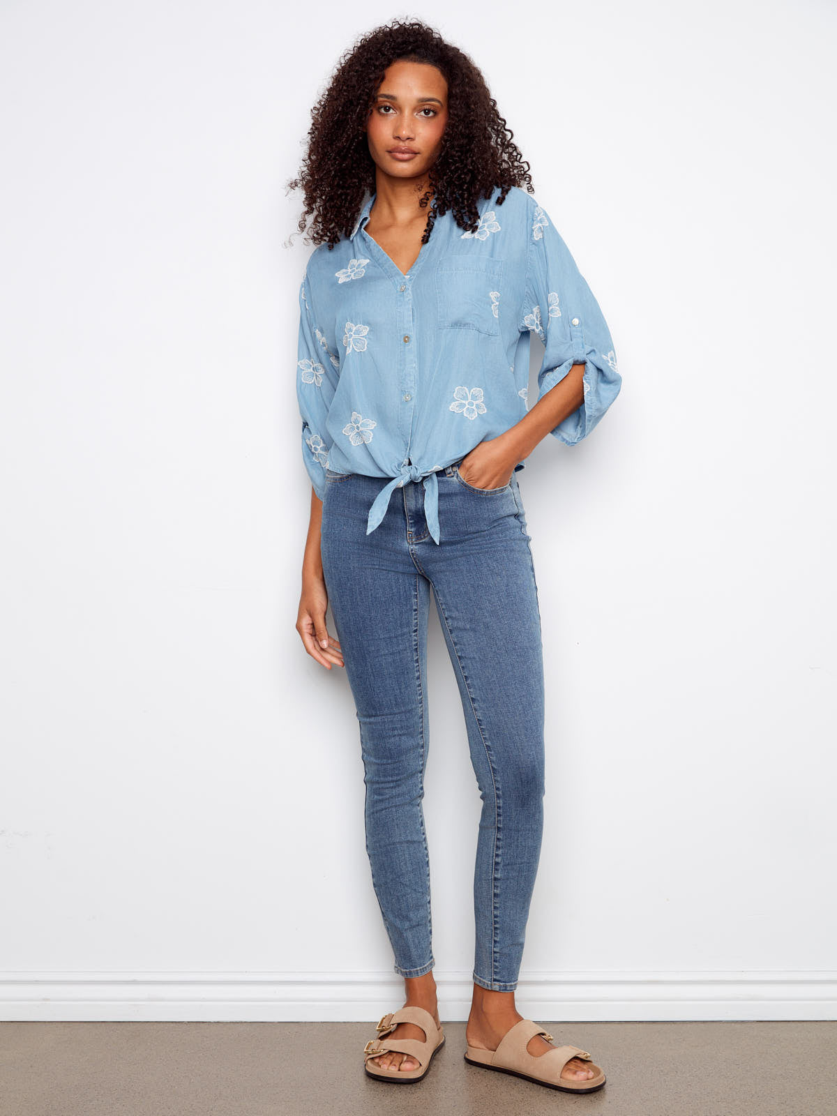 Charlie B Embroidered Flower Tencel Button Front Tie Top in light blue embroidered floral pattern with front tie detail