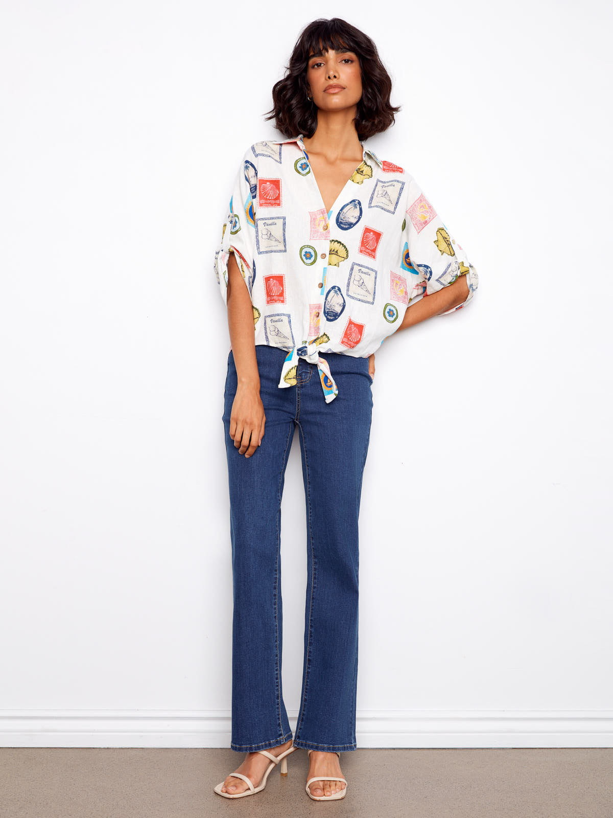 Charlie B Nautical Postcard Line Tie Top styled with blue denim jeans and beige heels by Charlie B.