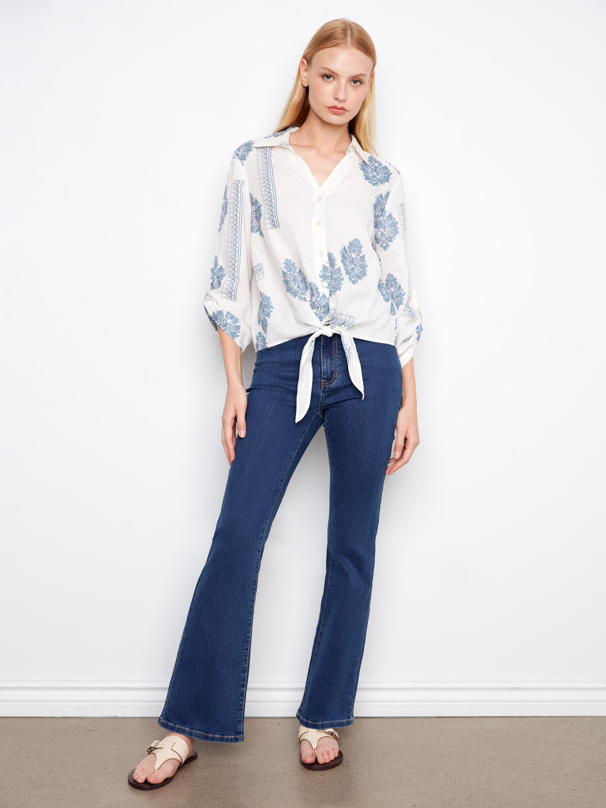 Charlie B Cool Guy Linen Button Front Tie Top with blue leaf prints styled with dark denim jeans and sandals by Charlie B