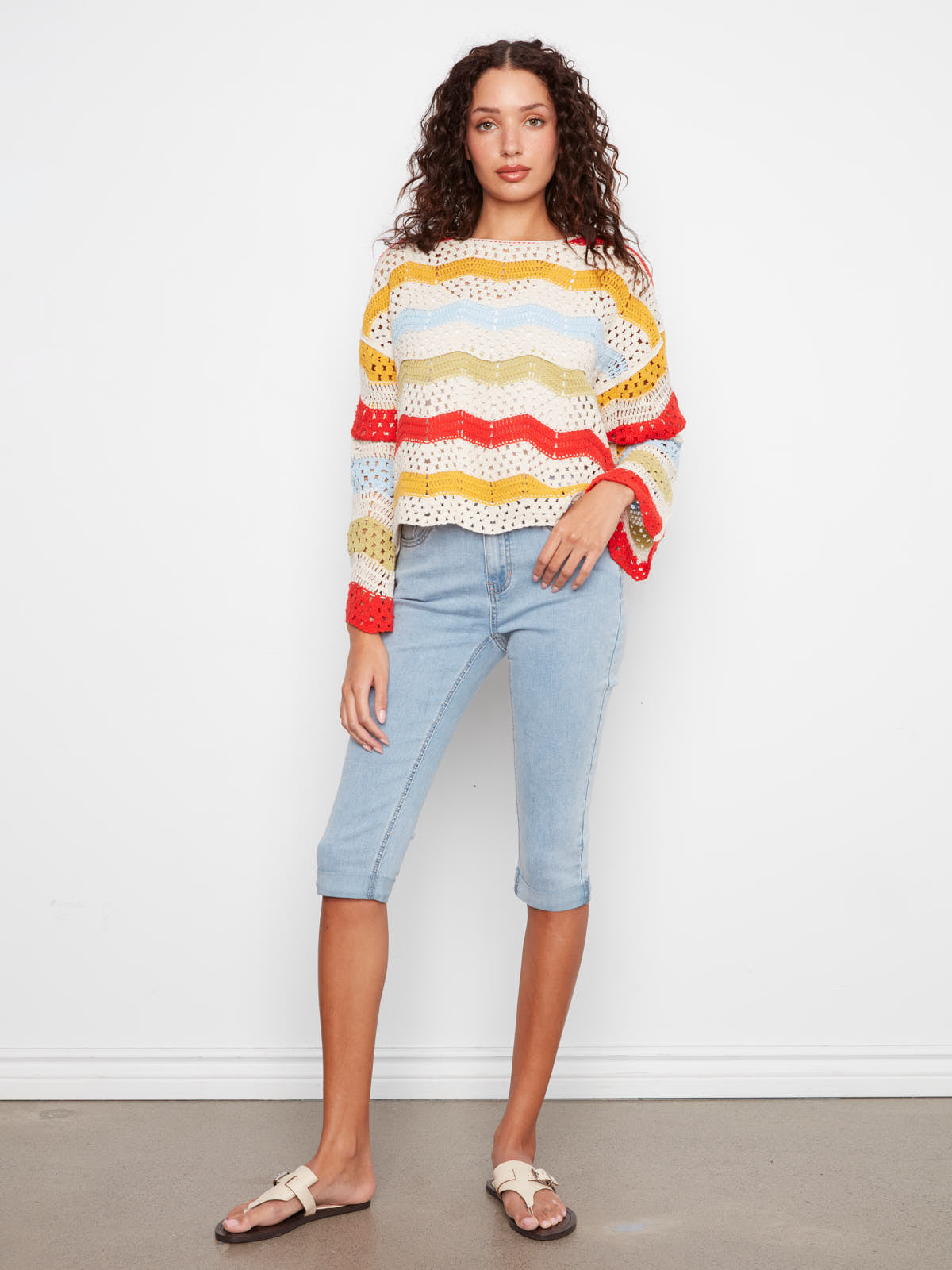 Charlie B Solstice Crochet Crew Top in yellow, red, and blue stripes by Charlie B paired with light denim capris