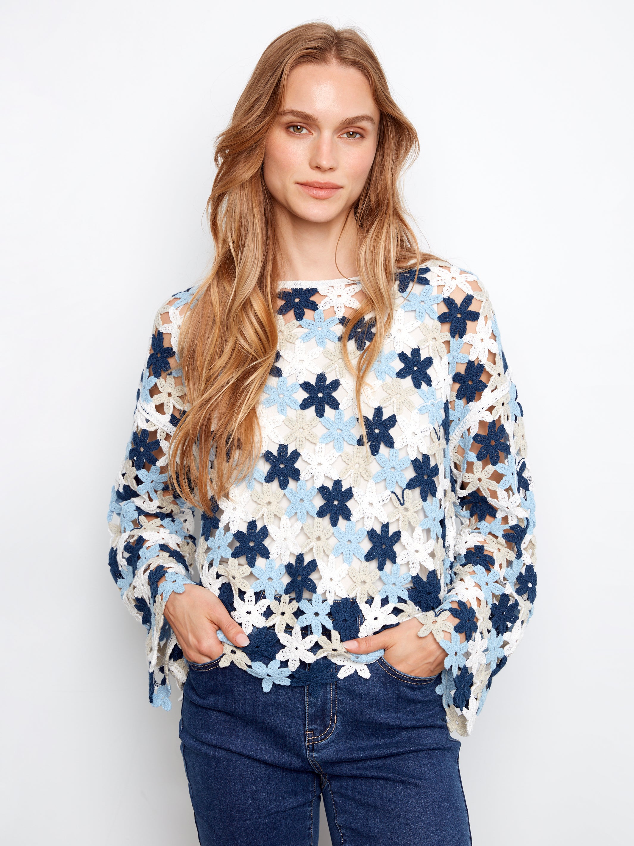 Charlie B Flower Crochet Top in blue and white floral crochet pattern paired with dark denim jeans by Charlie B